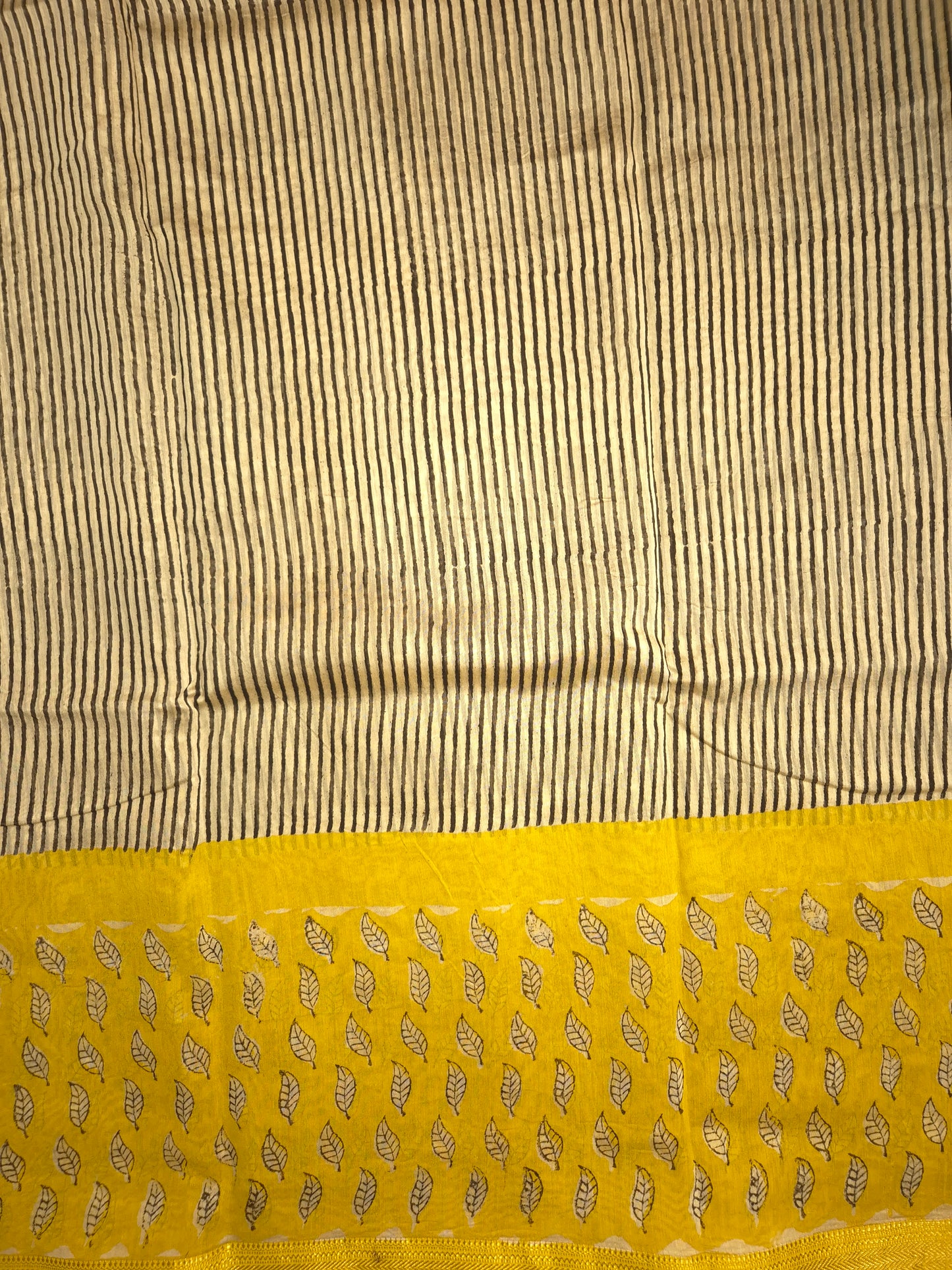 Ajrakh Printed Silk Saree with Striped Pattern and broad Yellow leaves print with Golden Zari Border