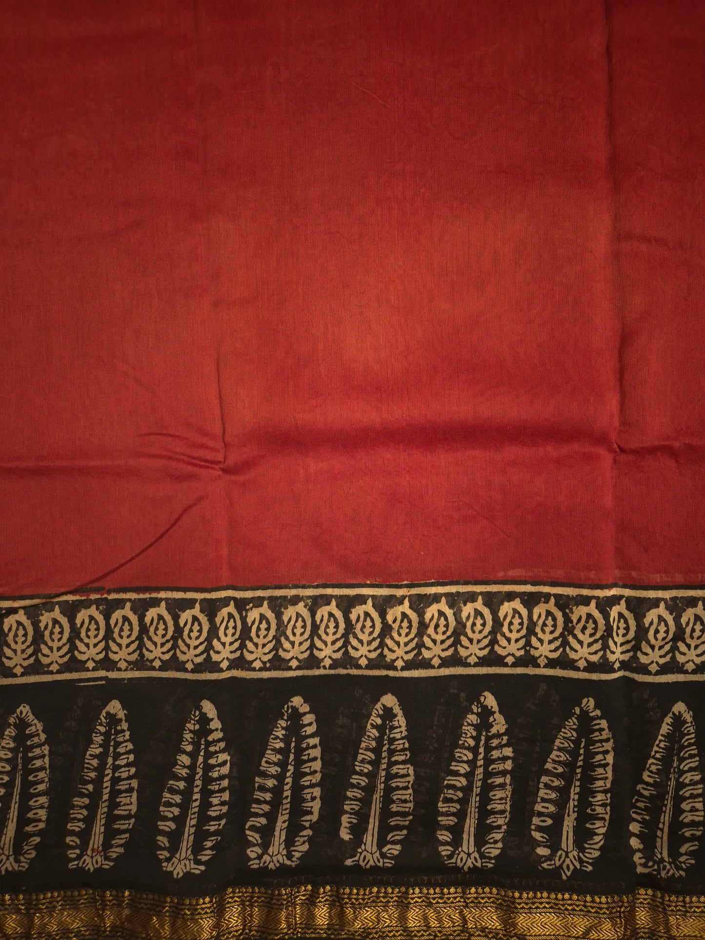 Rust Orange Ajrakh Printed Silk Saree with Intricate Leaf Motifs on Broad Black Border and Golden Zari