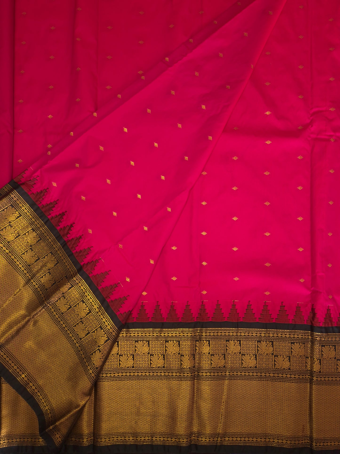 Rani Pink Gadwal Silk Saree with all-over Golden Buttas and Intricate Design on Black Border