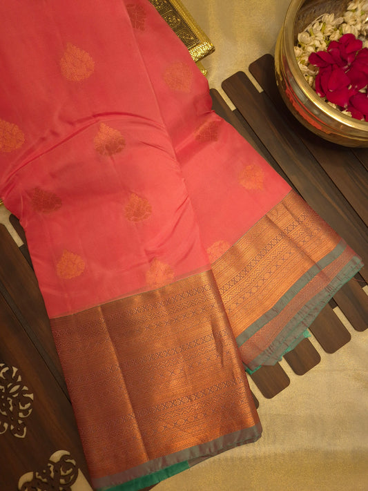 Elegant Peach Silk Saree with Butta and Teal Green Zari Border