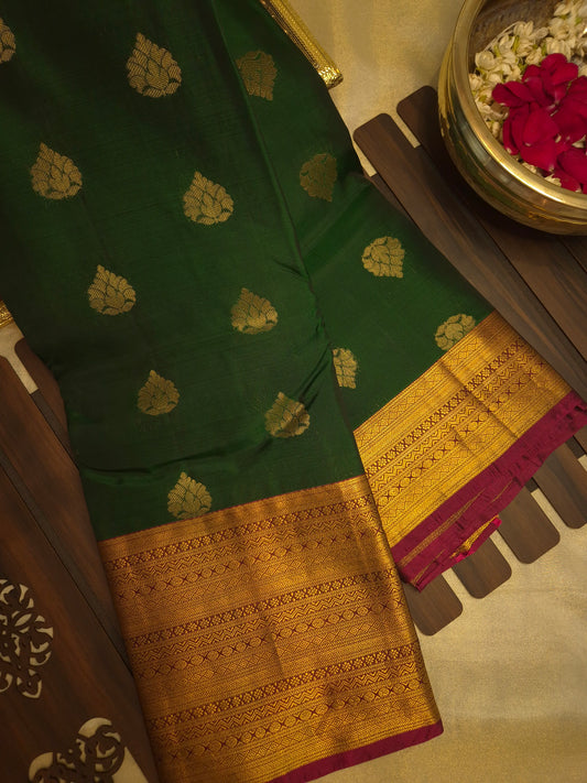 Dark Bottle Green Silk Saree with all over Butta pattern and Maroon Golden Zari Border