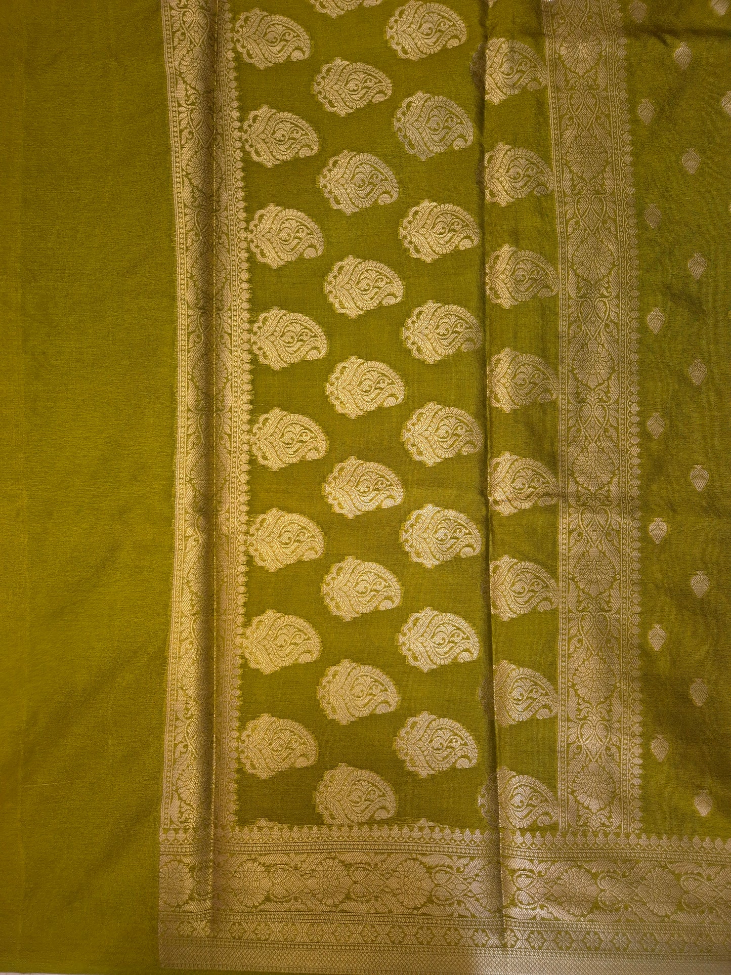 Banarasi Mehendi Green Warm Silk Saree with allover Butta Pattern and an intricate zari border