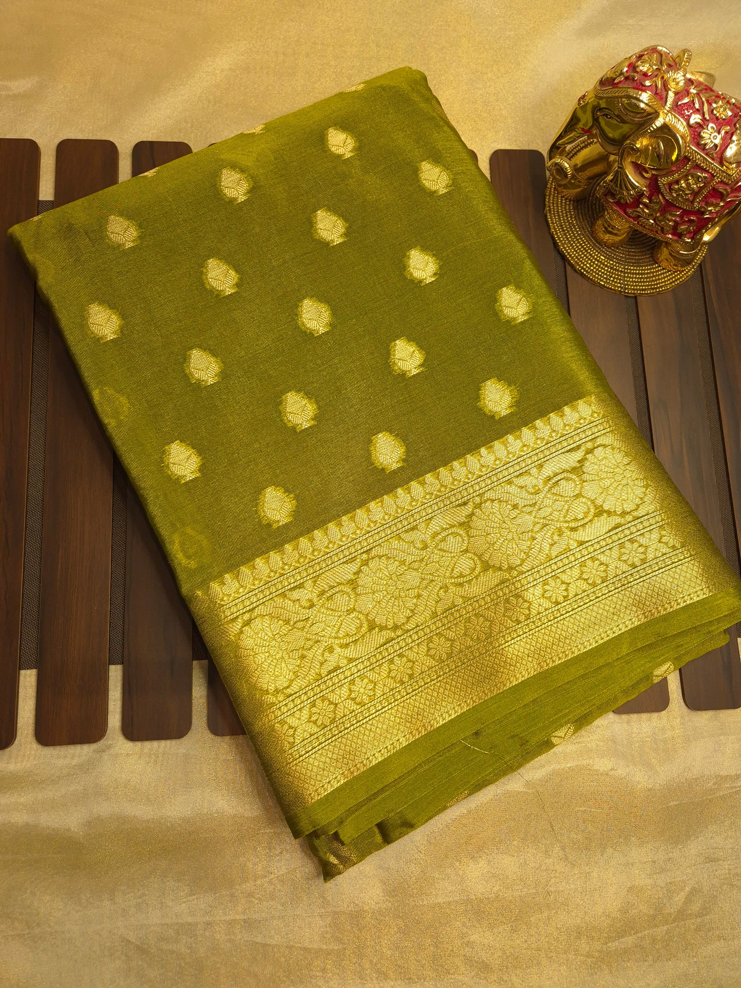Banarasi Mehendi Green Warm Silk Saree with allover Butta Pattern and an intricate zari border