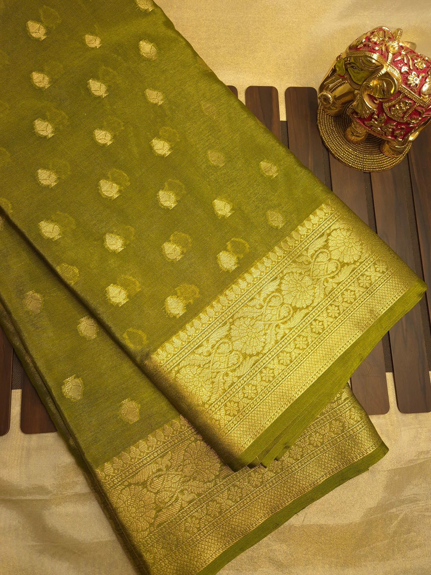 Banarasi Mehendi Green Warm Silk Saree with allover Butta Pattern and an intricate zari border