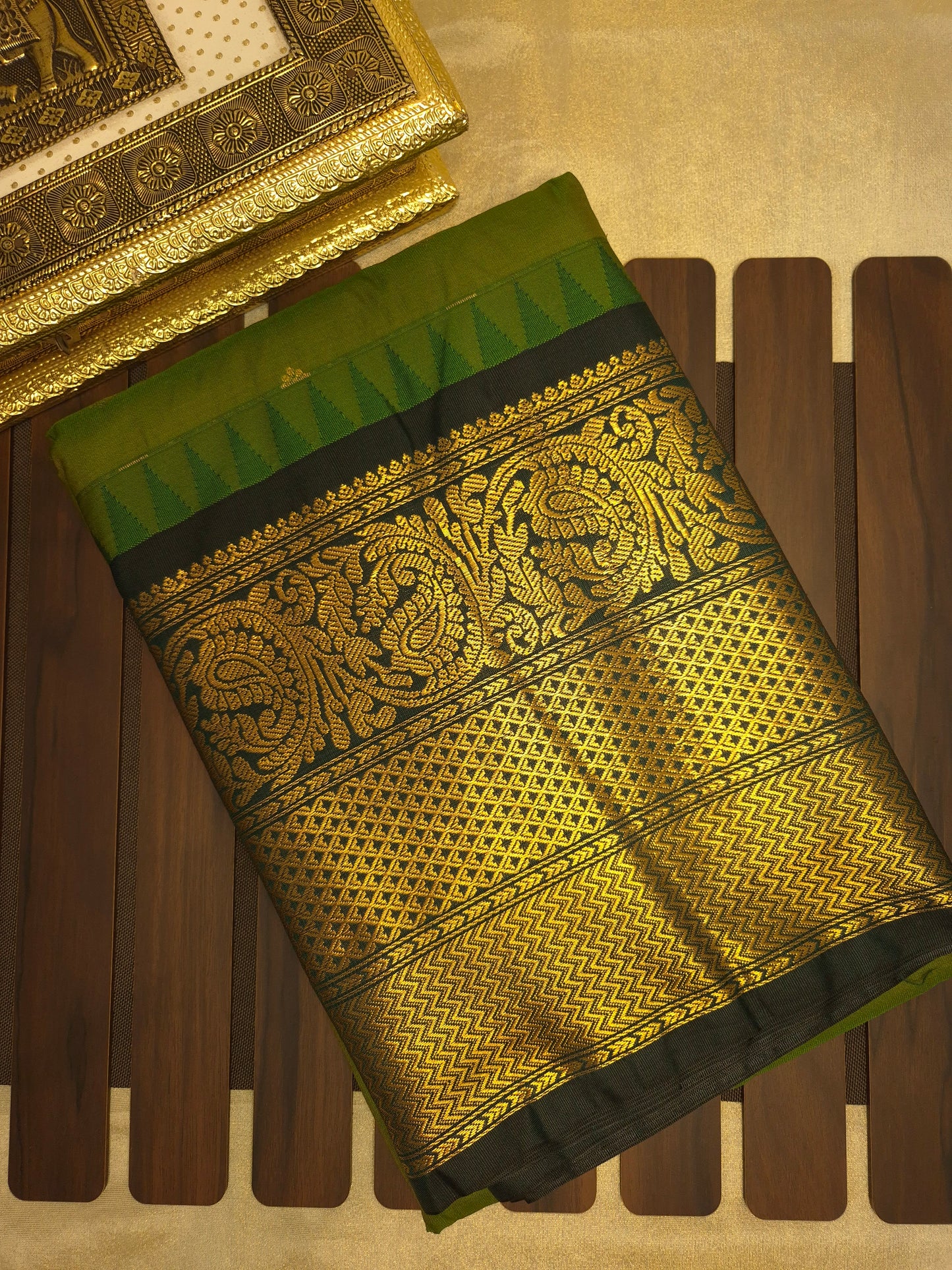 Mehendi Green Gadwal Silk Saree with all-over Golden Buttas and Intricate Design on Dark Green Border