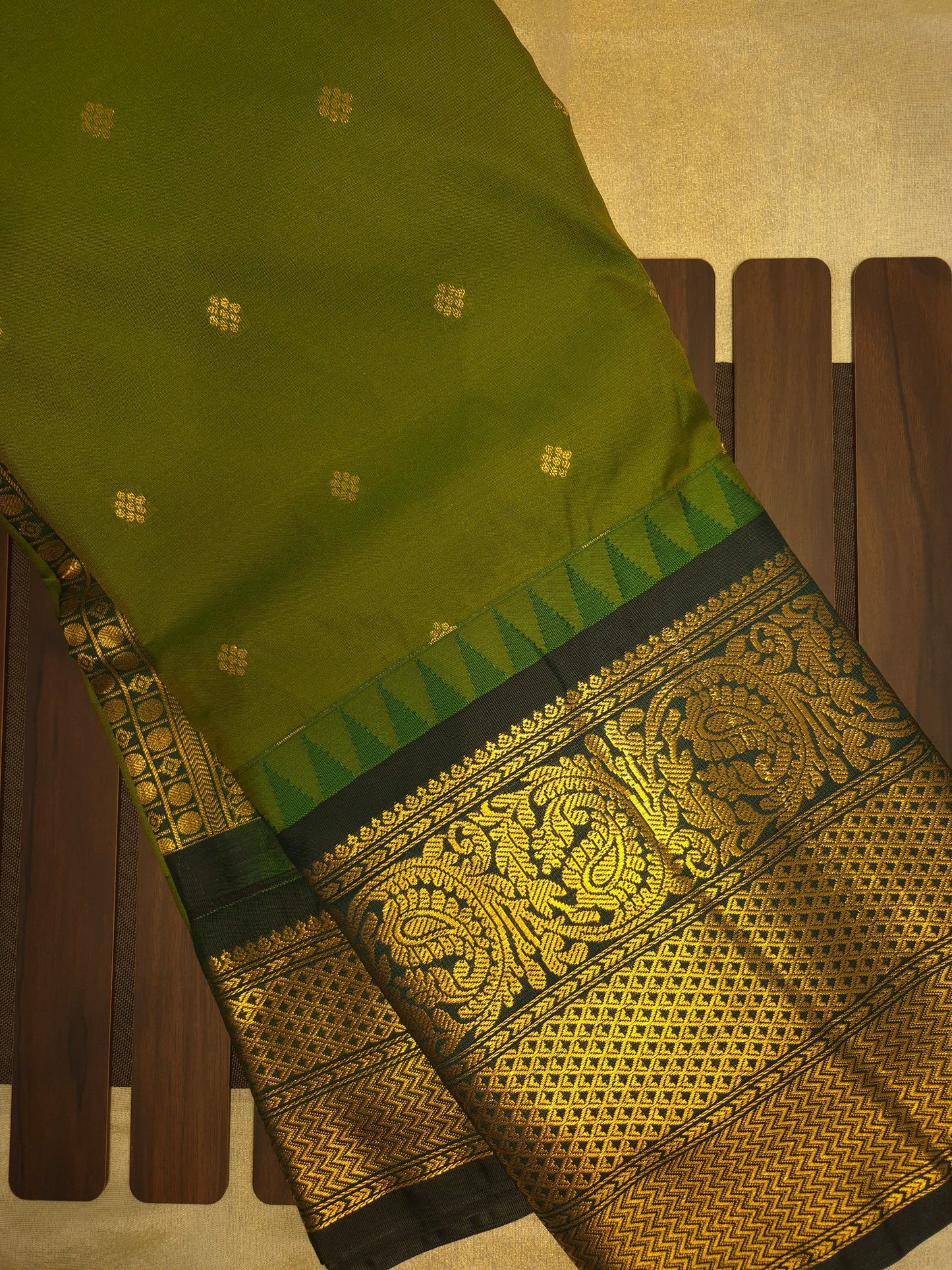 Mehendi Green Gadwal Silk Saree with all-over Golden Buttas and Intricate Design on Dark Green Border