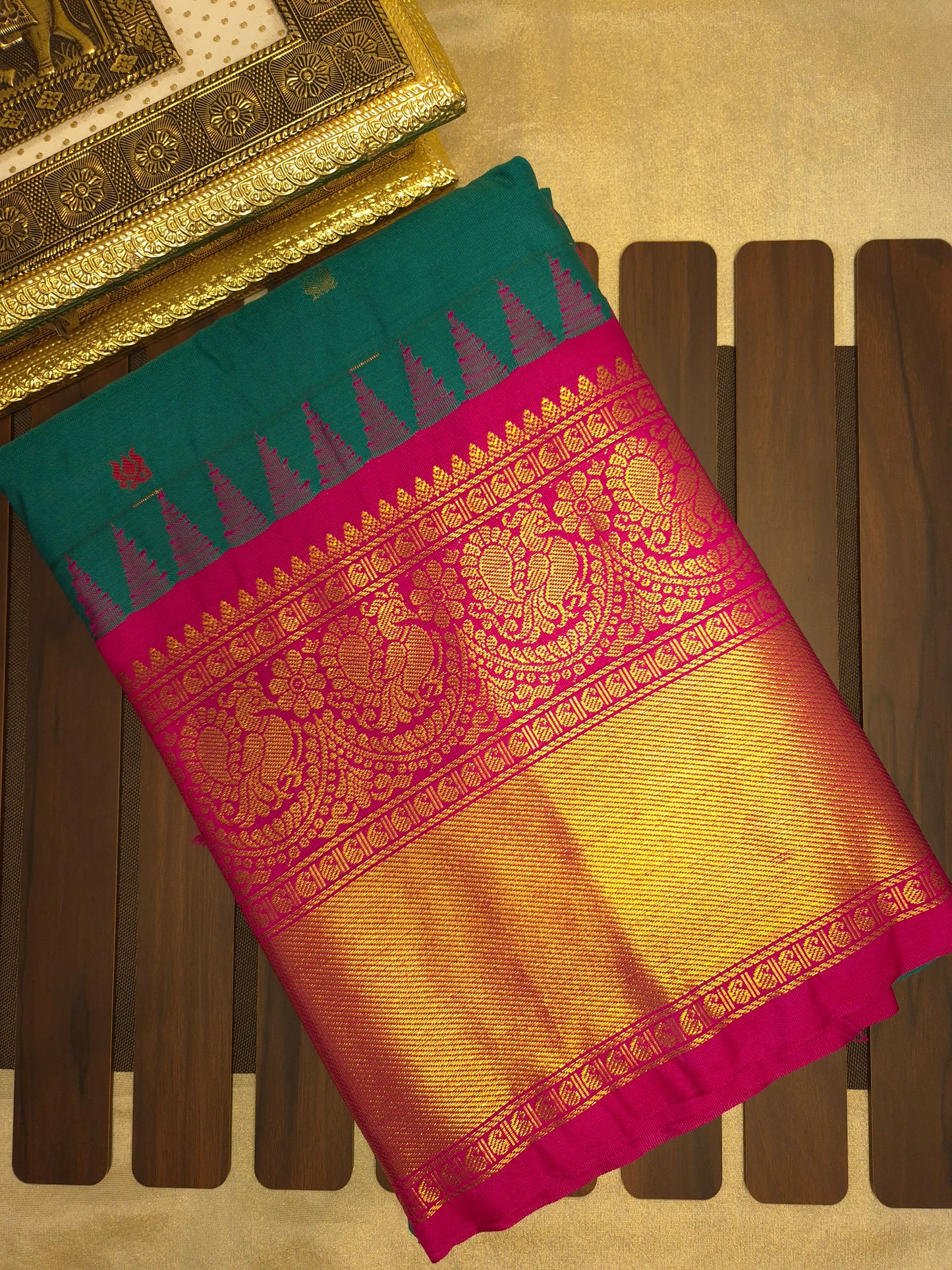 Deep Sea Green Gadwal Silk Saree with all-over Golden Buttas and Intricate Design on Rani Pink Colour Border