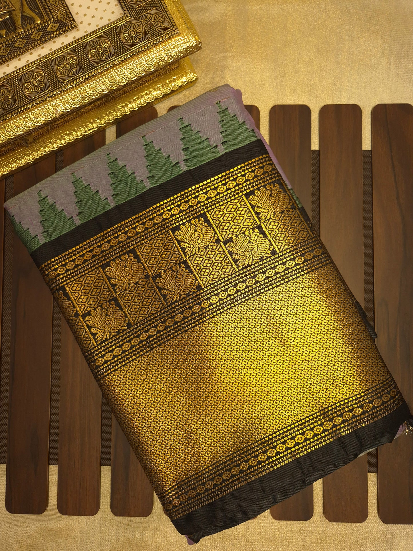 Lilac Gadwal Silk Saree with all-over Golden Buttas and Intricate Design on Black Border