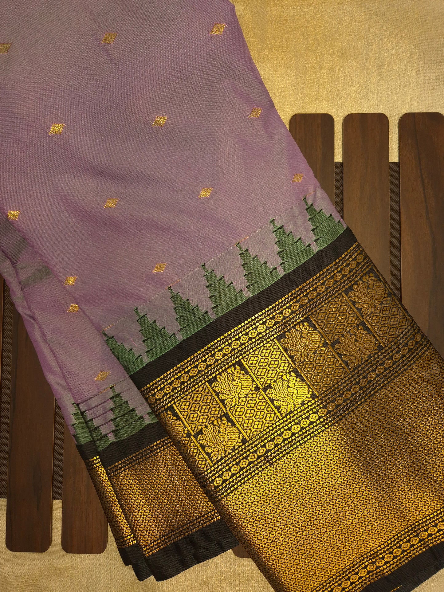 Lilac Gadwal Silk Saree with all-over Golden Buttas and Intricate Design on Black Border