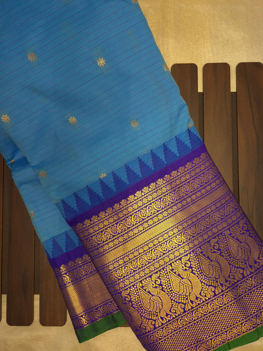 Blue Gadwal Silk Saree with all-over Golden Buttas and Intricate Design on Violet Border