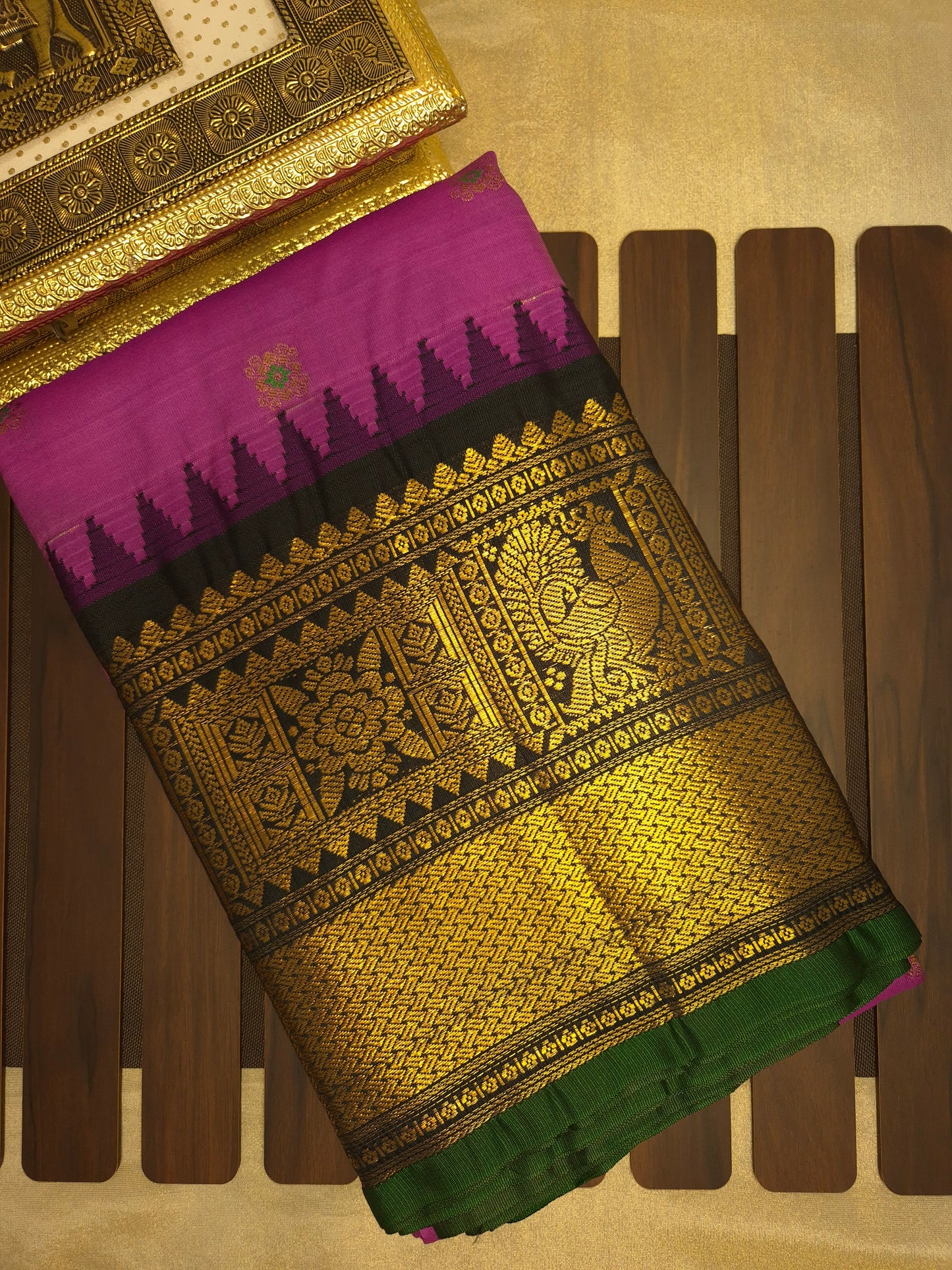 Magenta Pink Gadwal Silk Saree with all-over Golden Buttas and Intricate Design on Black Border