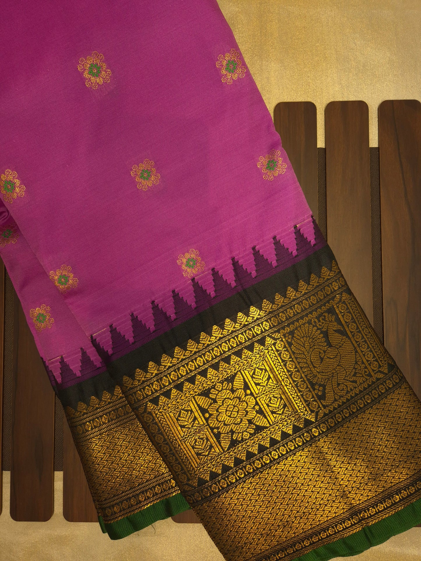 Magenta Pink Gadwal Silk Saree with all-over Golden Buttas and Intricate Design on Black Border