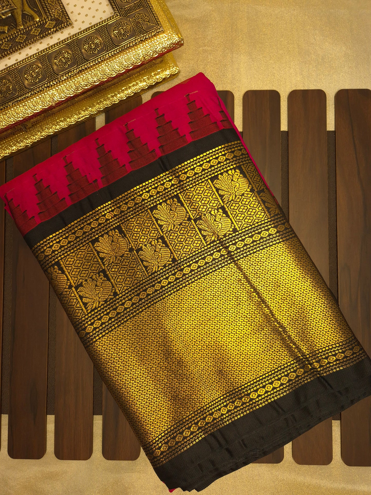 Rani Pink Gadwal Silk Saree with all-over Golden Buttas and Intricate Design on Black Border