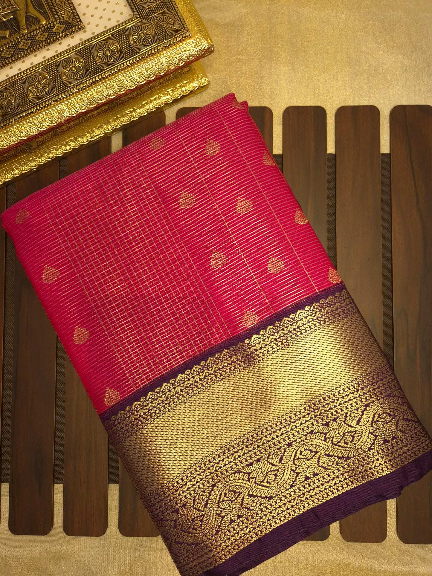 Rani Pink Kanchipuram Semi Silk Saree with fine checks and lines all over the saree with Purple Border