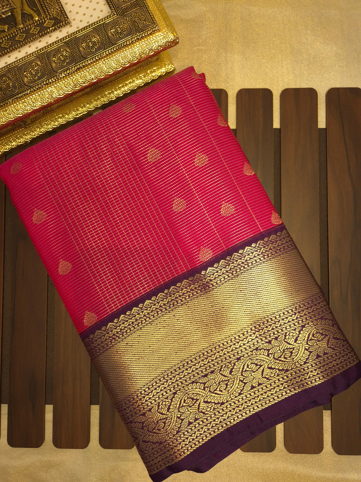 Rani Pink Kanchipuram Semi Silk Saree with fine checks and lines all over the saree with Purple Border