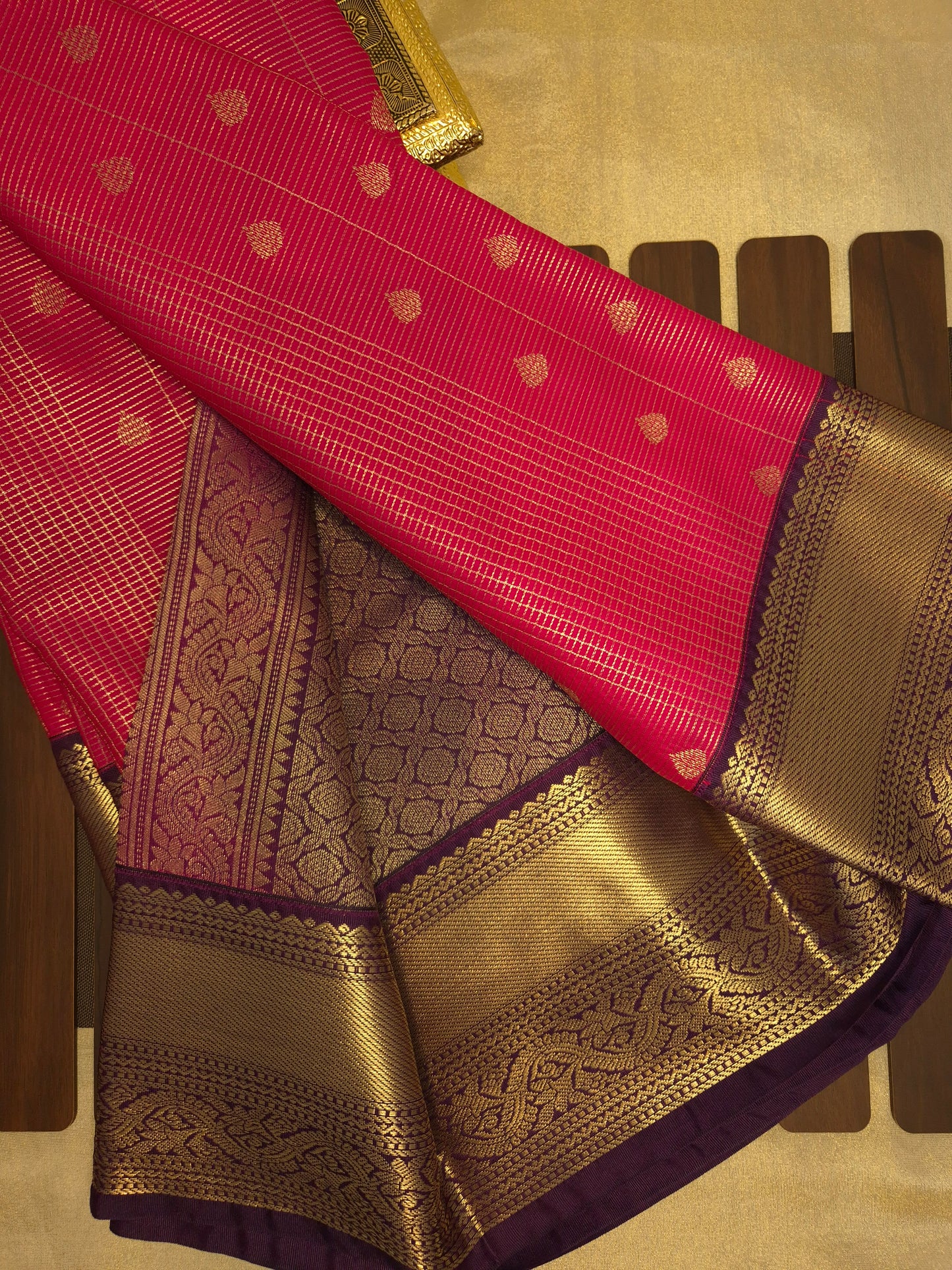 Rani Pink Kanchipuram Semi Silk Saree with fine checks and lines all over the saree with Purple Border