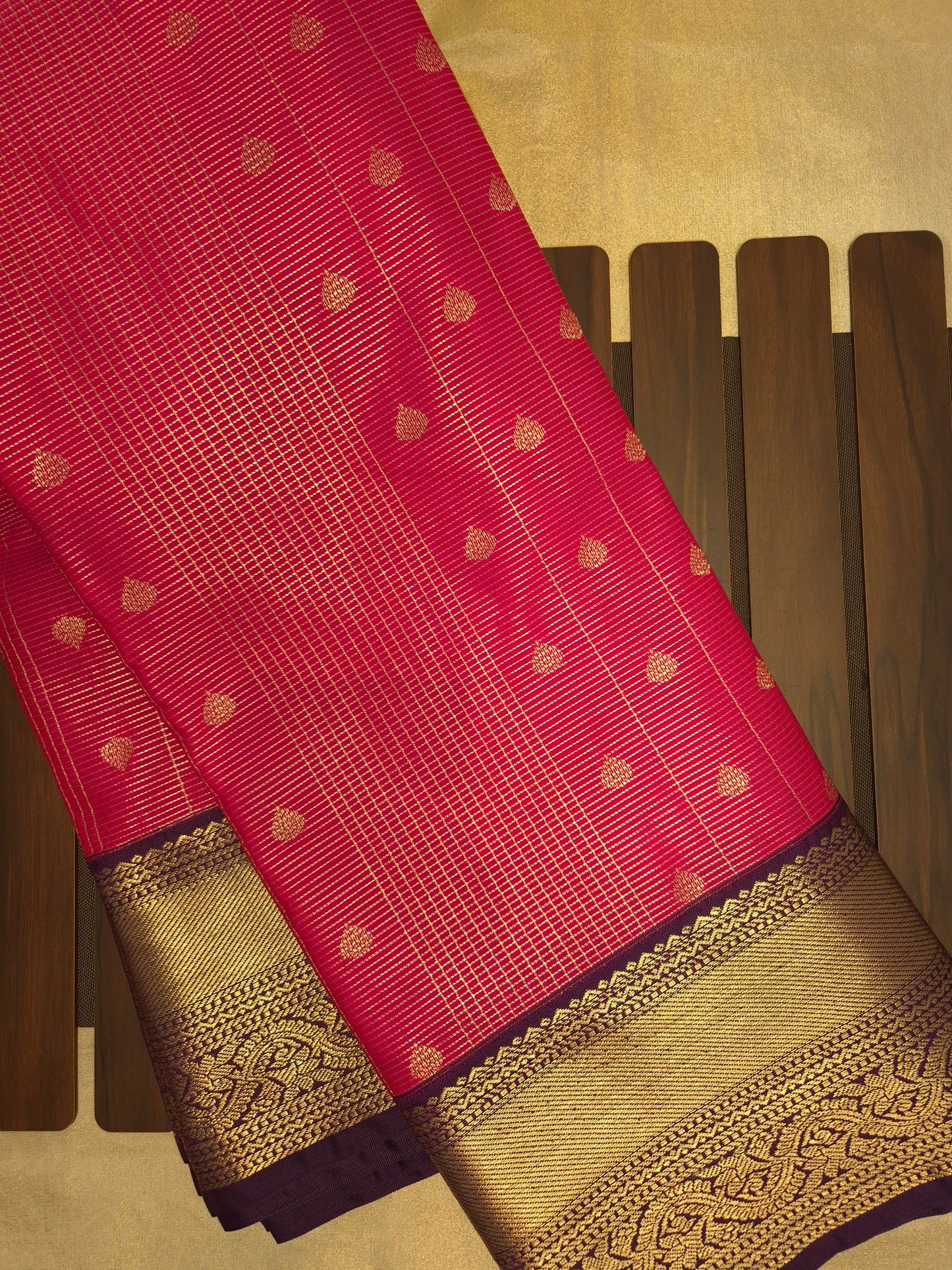 Rani Pink Kanchipuram Semi Silk Saree with fine checks and lines all over the saree with Purple Border