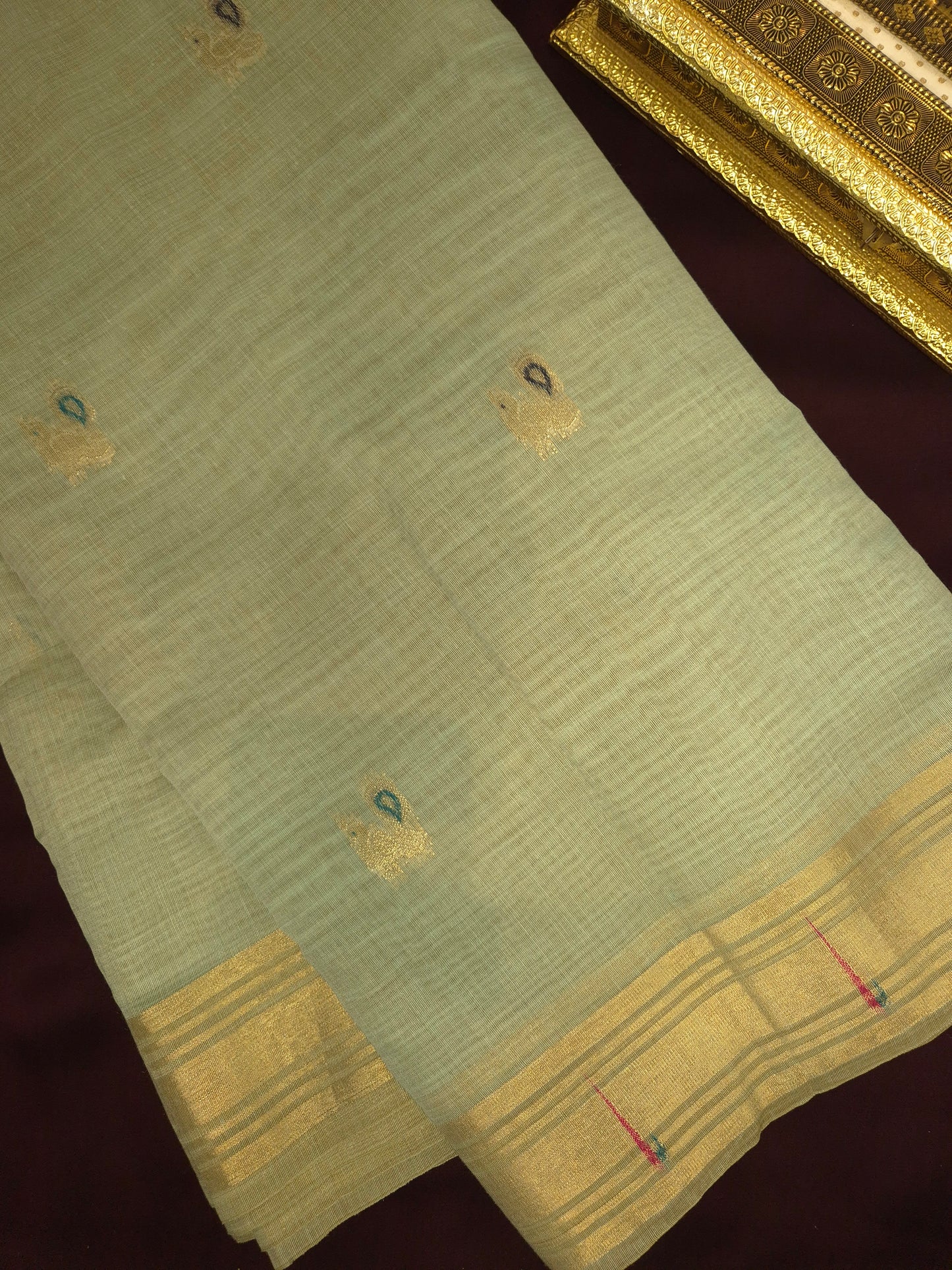 Light Blue Jamdani Saree with Golden Zari Peacock Buttas and Colorful Peacock Motifs on Pallu