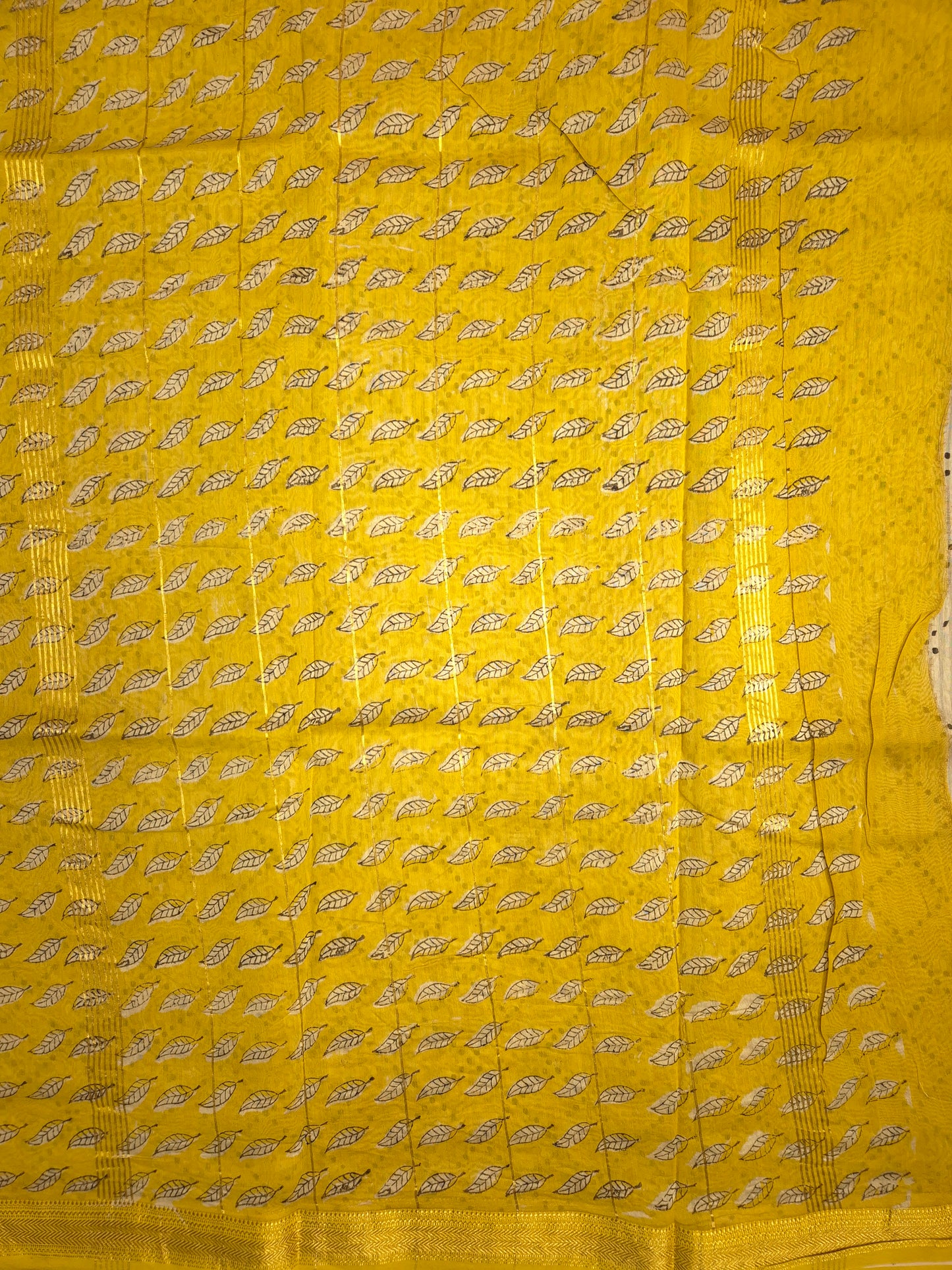 Ajrakh Printed Silk Saree with Striped Pattern and broad Yellow leaves print with Golden Zari Border