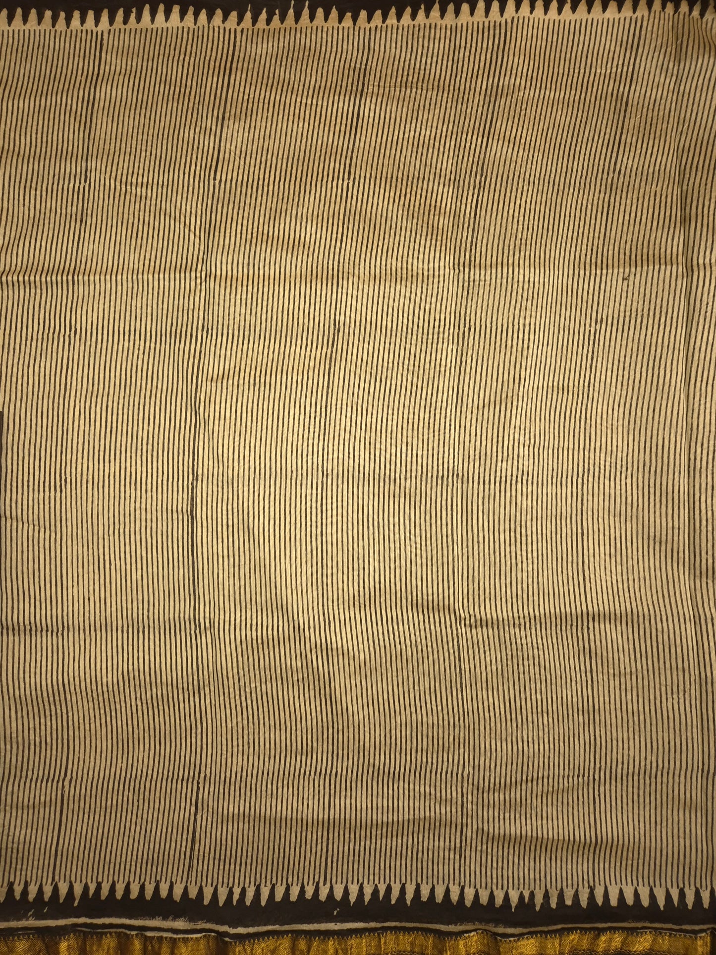 Ajrakh Printed Silk Saree with striped pattern and small intricate temple golden Zari Border