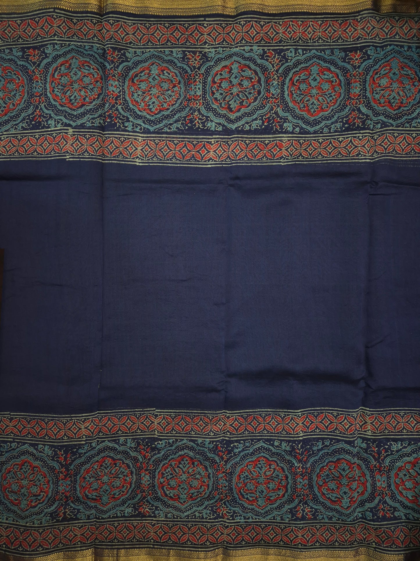 Navy Blue Ajrakh Printed Silk Saree with Intricate Floral Broad Border with Golden Zari