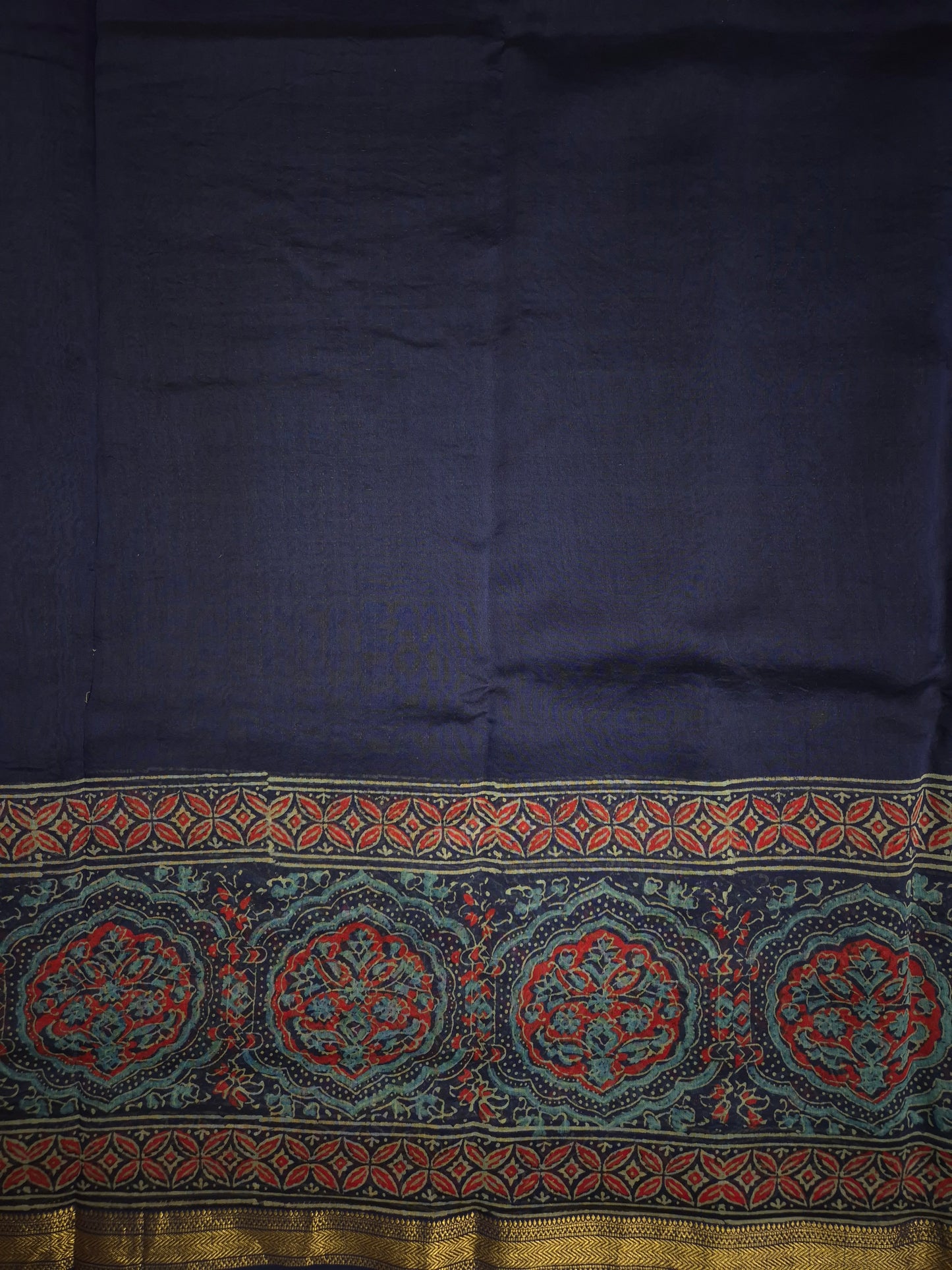 Navy Blue Ajrakh Printed Silk Saree with Intricate Floral Broad Border with Golden Zari
