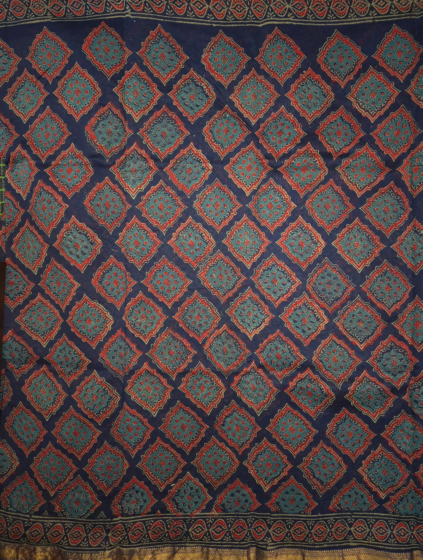 Navy Blue Ajrakh Printed Silk Saree with all-over Intricate Design with Golden Zari