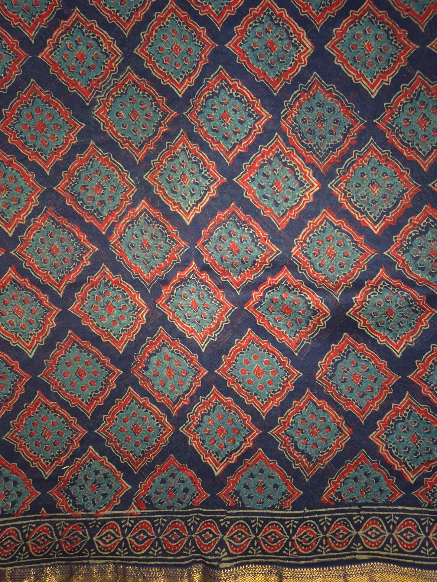 Navy Blue Ajrakh Printed Silk Saree with all-over Intricate Design with Golden Zari