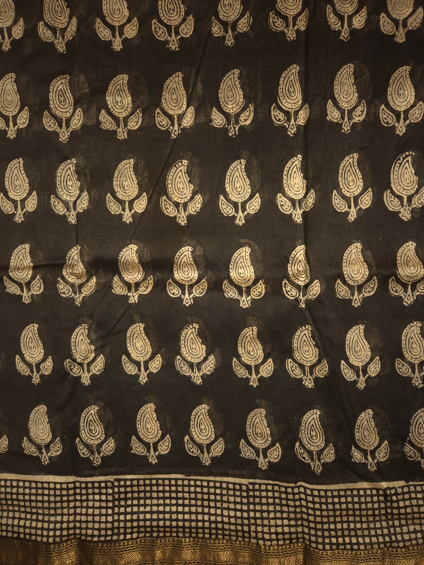 Black Ajrakh Printed Silk Saree with all-over Intricate Motifs and Checkered Border with Golden Zari