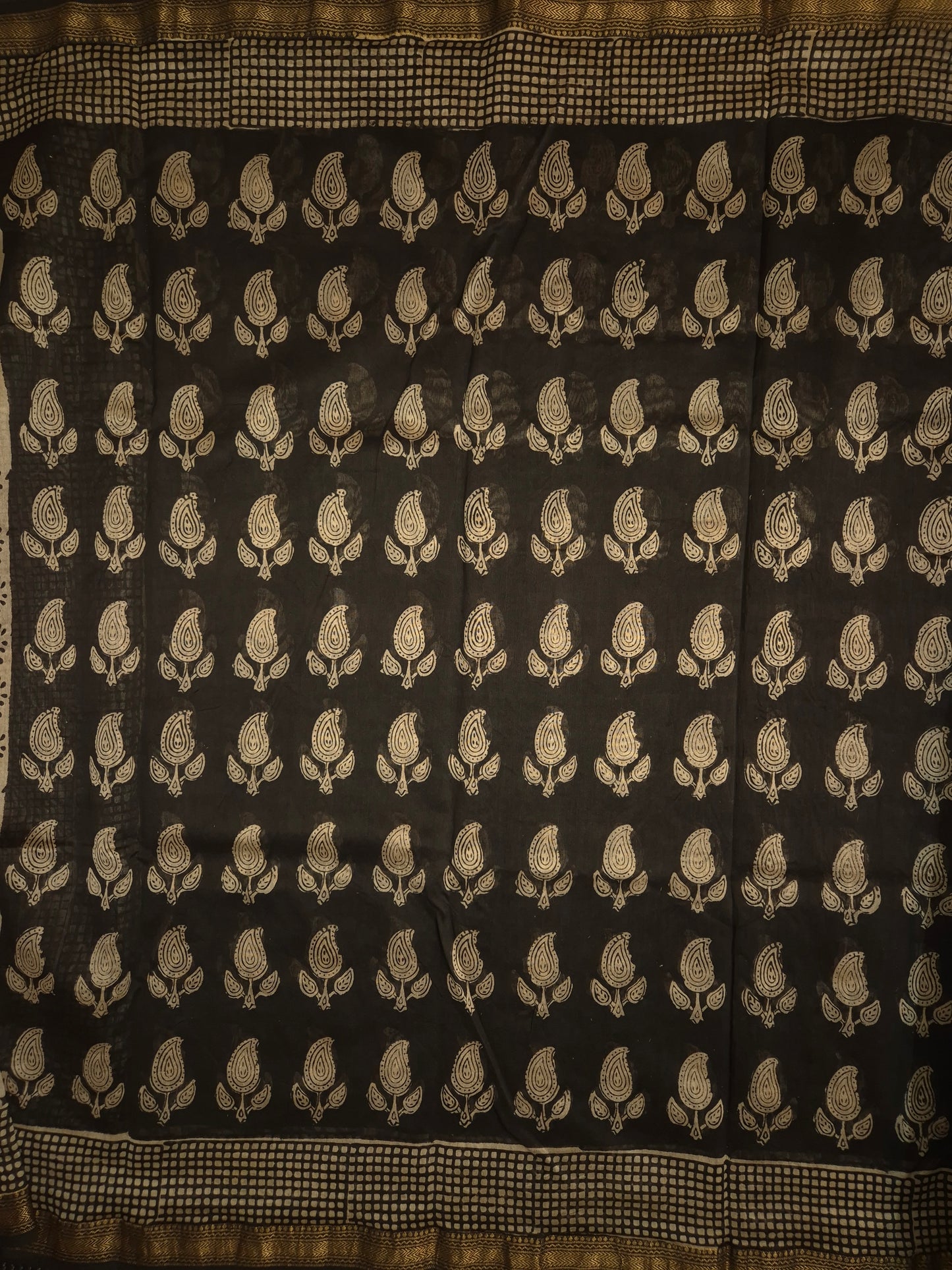 Black Ajrakh Printed Silk Saree with all-over Intricate Motifs and Checkered Border with Golden Zari