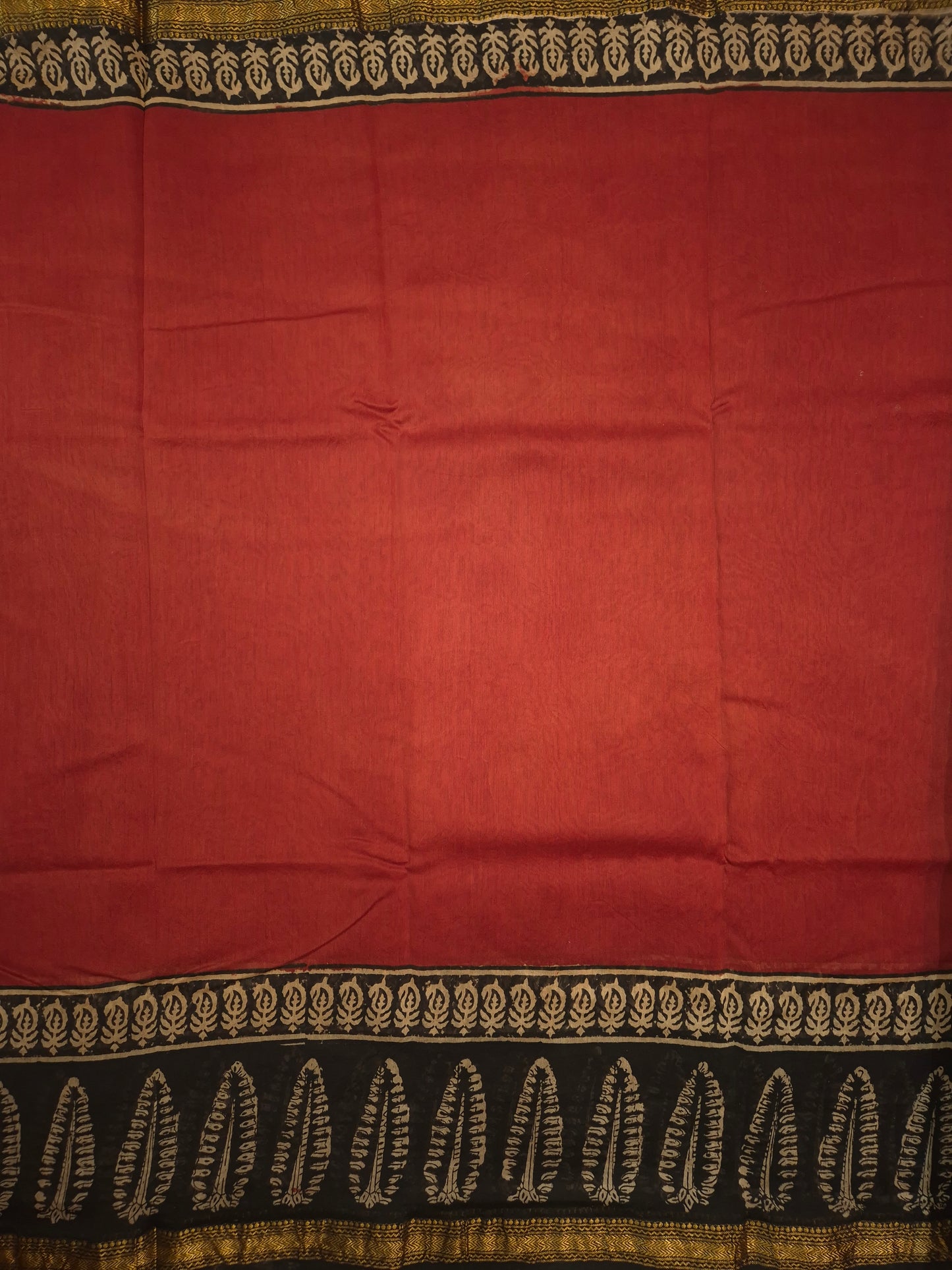 Rust Orange Ajrakh Printed Silk Saree with Intricate Leaf Motifs on Broad Black Border and Golden Zari