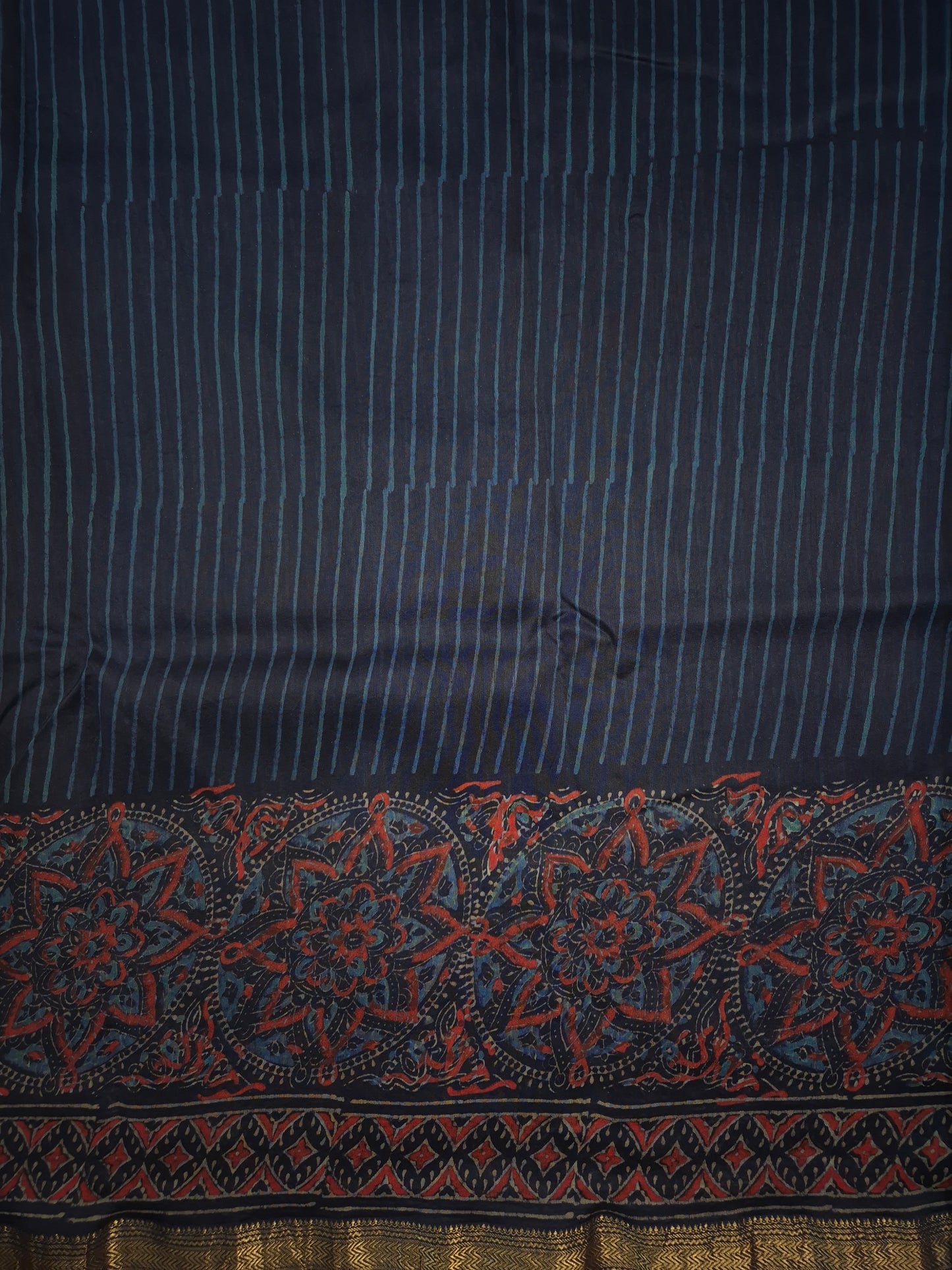 Navy Blue Striped Ajrakh Printed Silk Saree with Intricate Floral Broad Border and Golden Zari