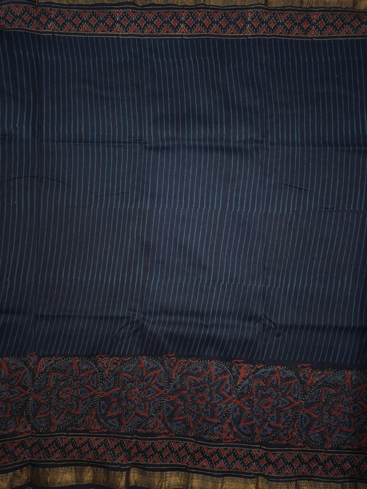 Navy Blue Striped Ajrakh Printed Silk Saree with Intricate Floral Broad Border and Golden Zari