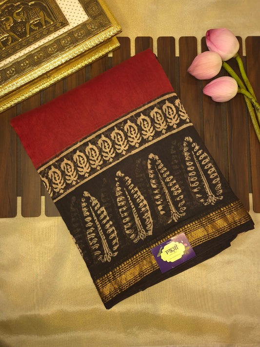 Rust Orange Ajrakh Printed Silk Saree with Intricate Leaf Motifs on Broad Black Border and Golden Zari