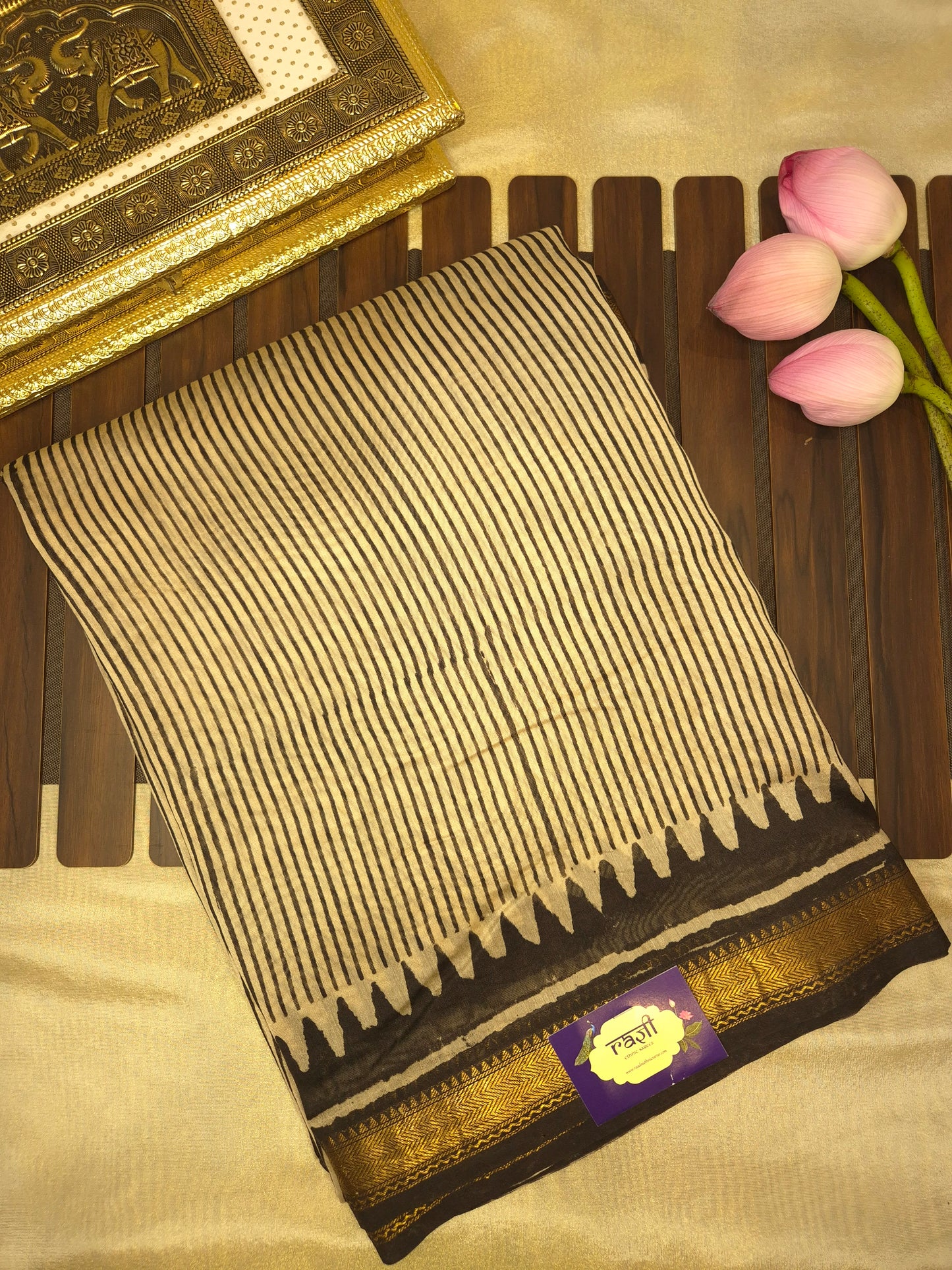 Ajrakh Printed Silk Saree with striped pattern and small intricate temple golden Zari Border