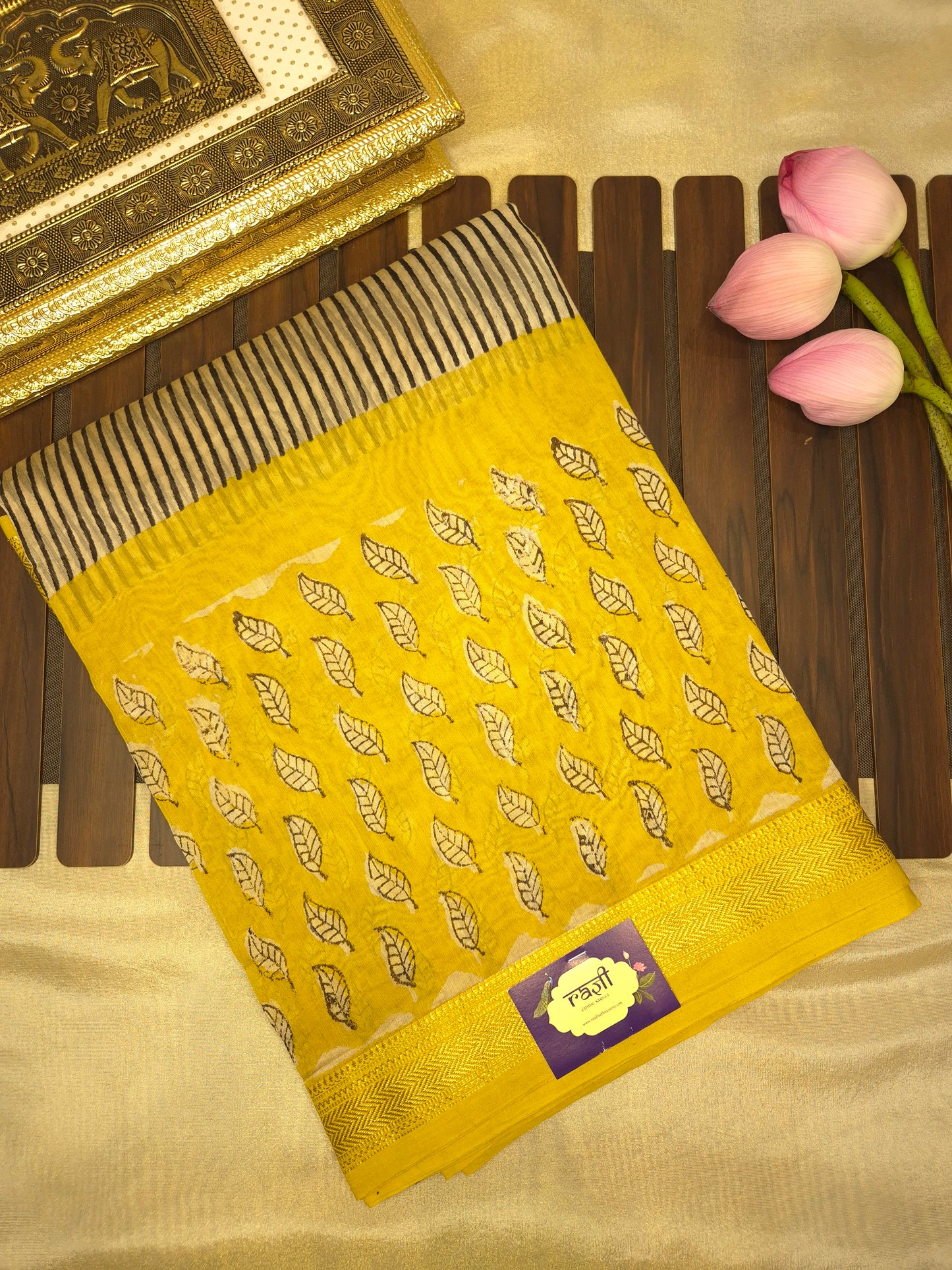 Ajrakh Printed Silk Saree with Striped Pattern and broad Yellow leaves print with Golden Zari Border
