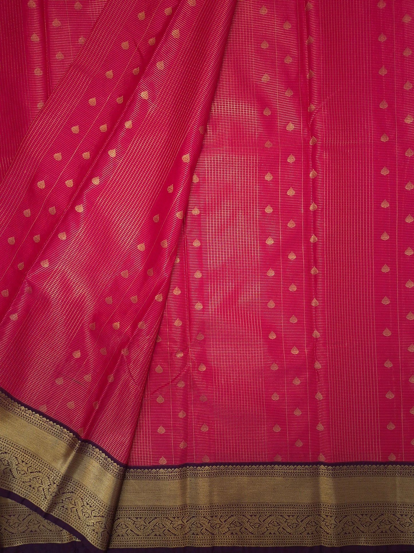 Rani Pink Kanchipuram Semi Silk Saree with fine checks and lines all over the saree with Purple Border