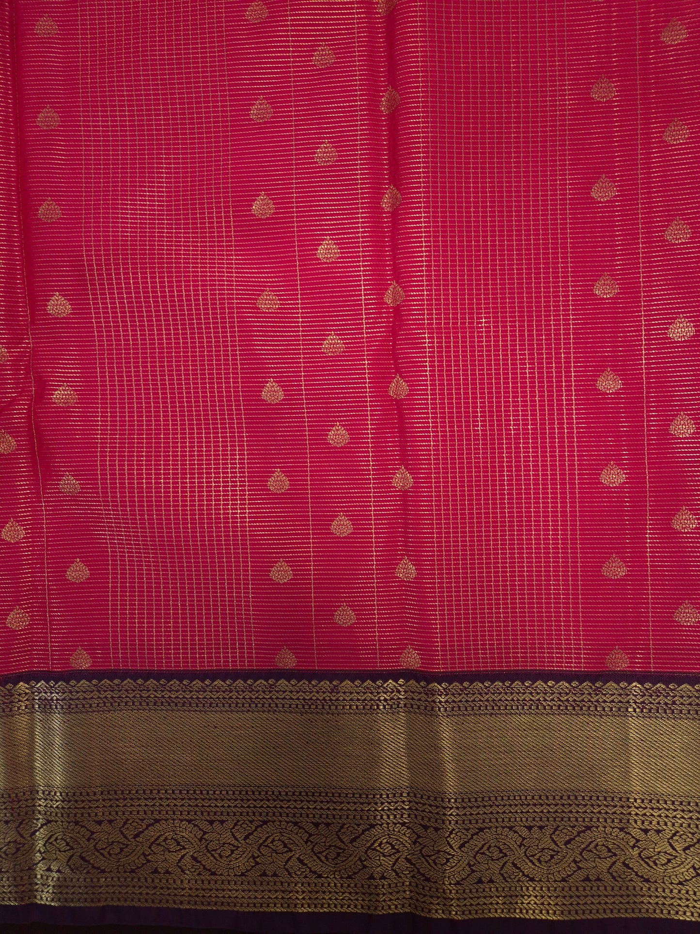 Rani Pink Kanchipuram Semi Silk Saree with fine checks and lines all over the saree with Purple Border