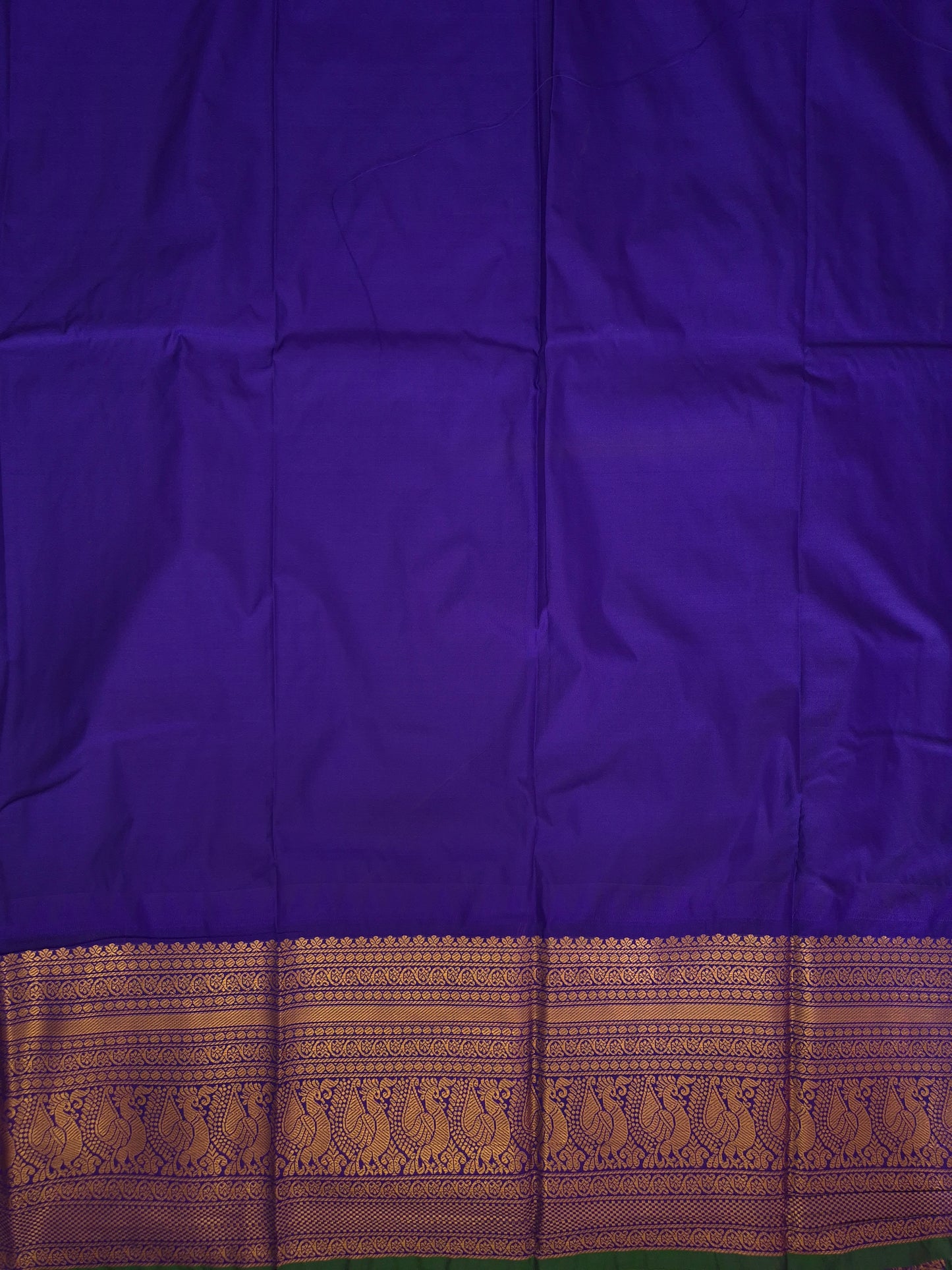 Blue Gadwal Silk Saree with all-over Golden Buttas and Intricate Design on Violet Border