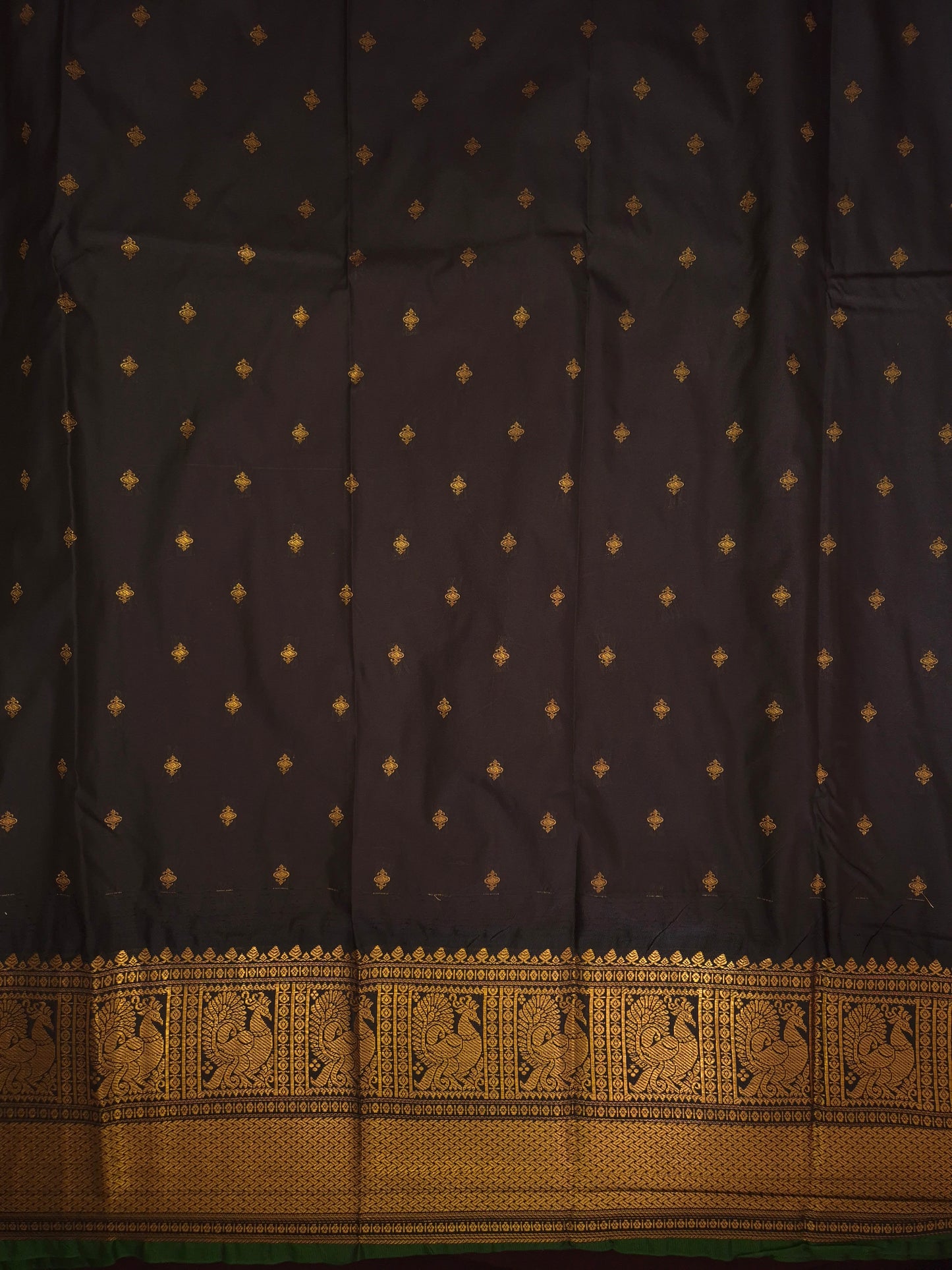 Magenta Pink Gadwal Silk Saree with all-over Golden Buttas and Intricate Design on Black Border