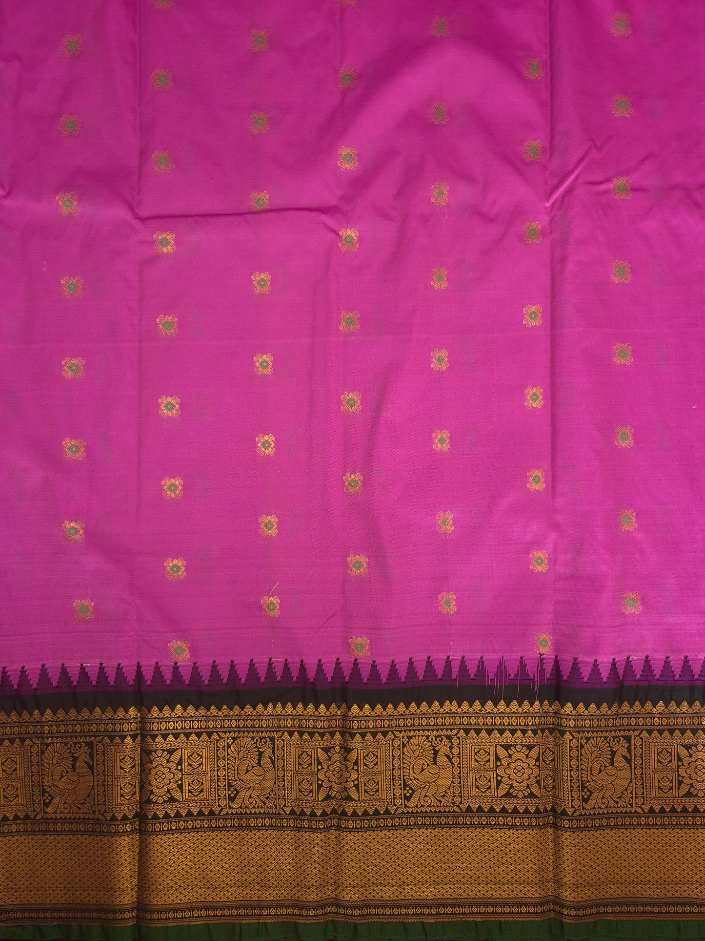 Magenta Pink Gadwal Silk Saree with all-over Golden Buttas and Intricate Design on Black Border
