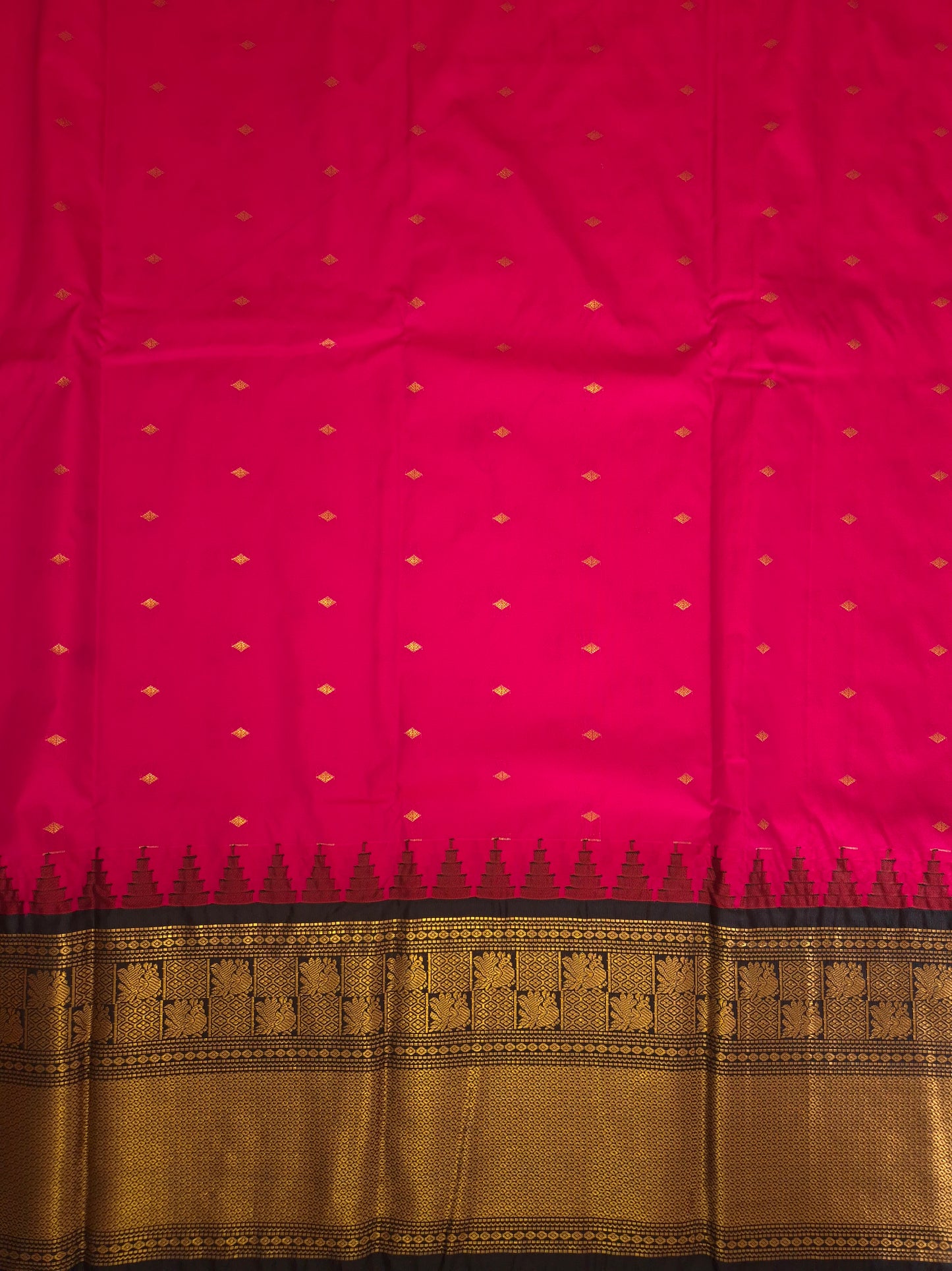Rani Pink Gadwal Silk Saree with all-over Golden Buttas and Intricate Design on Black Border