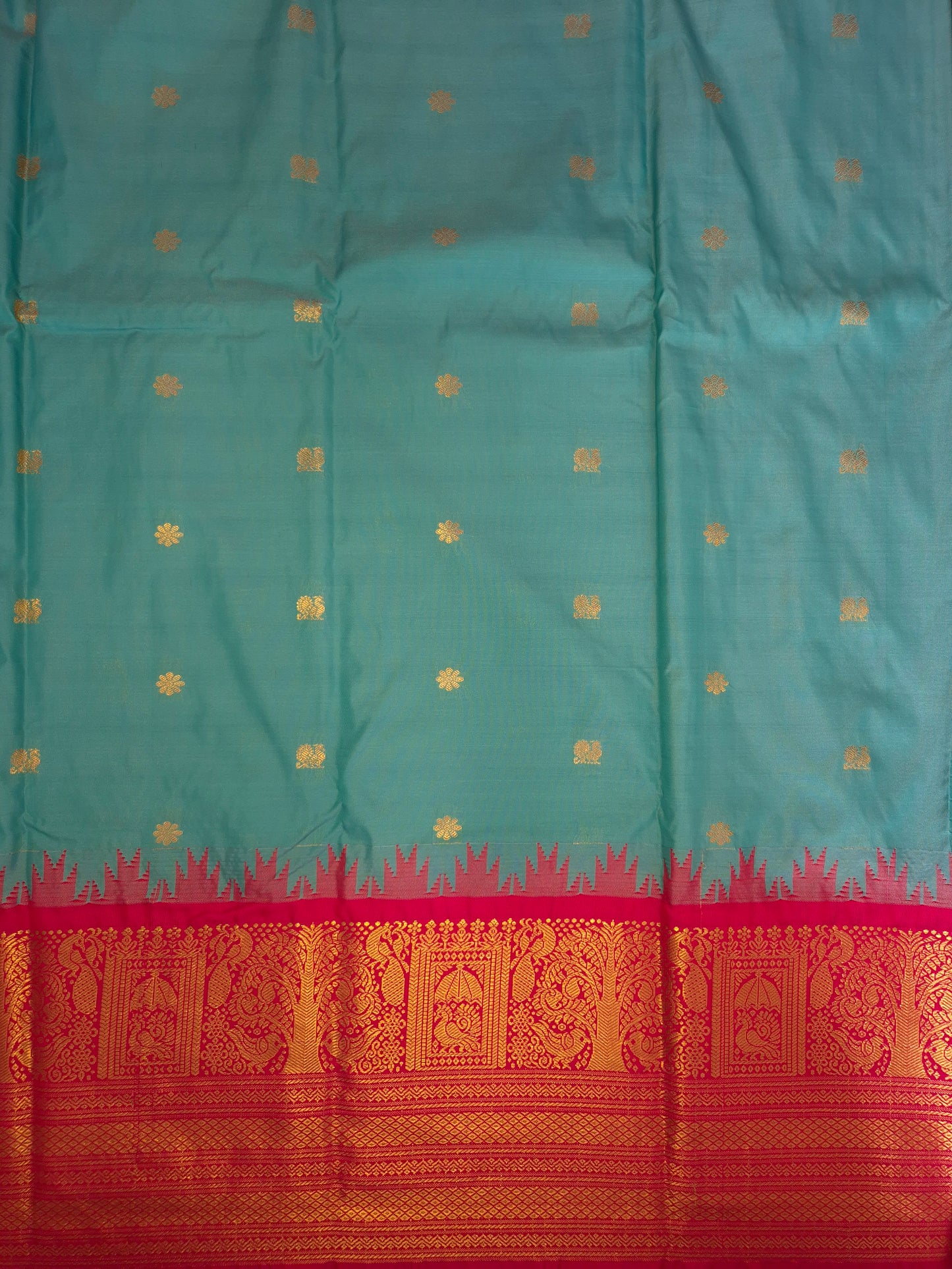 Turquoise Blue Gadwal Silk Saree with all-over Golden Buttas and Intricate Design on Red Border