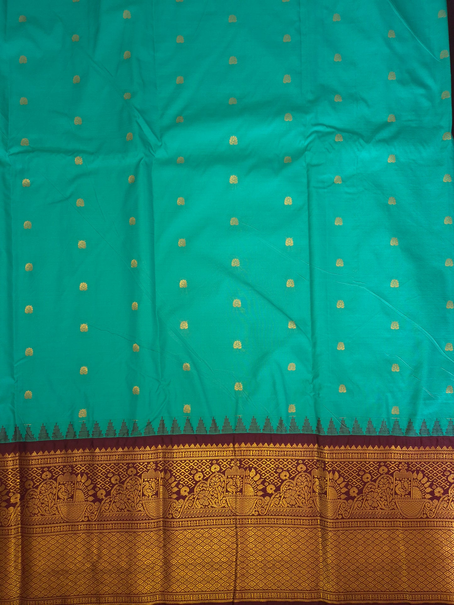 Peacock Green Gadwal Silk Saree with all-over Golden Buttas and Intricate Design on Wine Colour Border