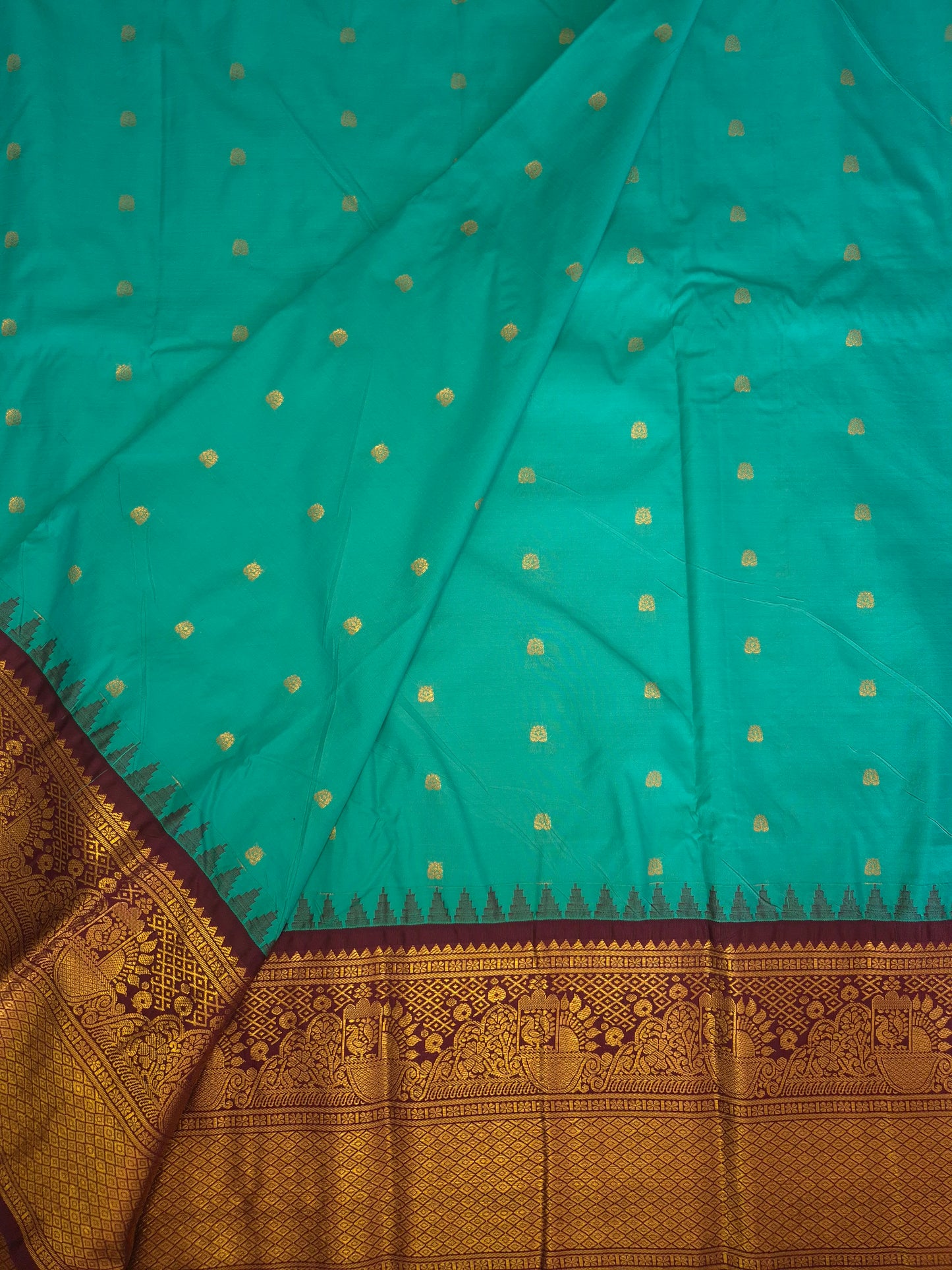 Peacock Green Gadwal Silk Saree with all-over Golden Buttas and Intricate Design on Wine Colour Border
