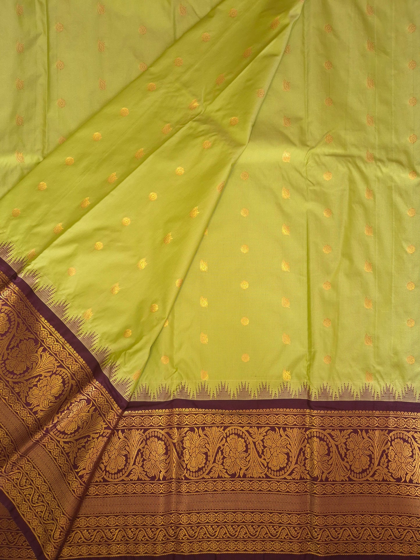 Light Green Gadwal Silk Saree with all-over Golden Buttas and Intricate Design on Wine Colour Border