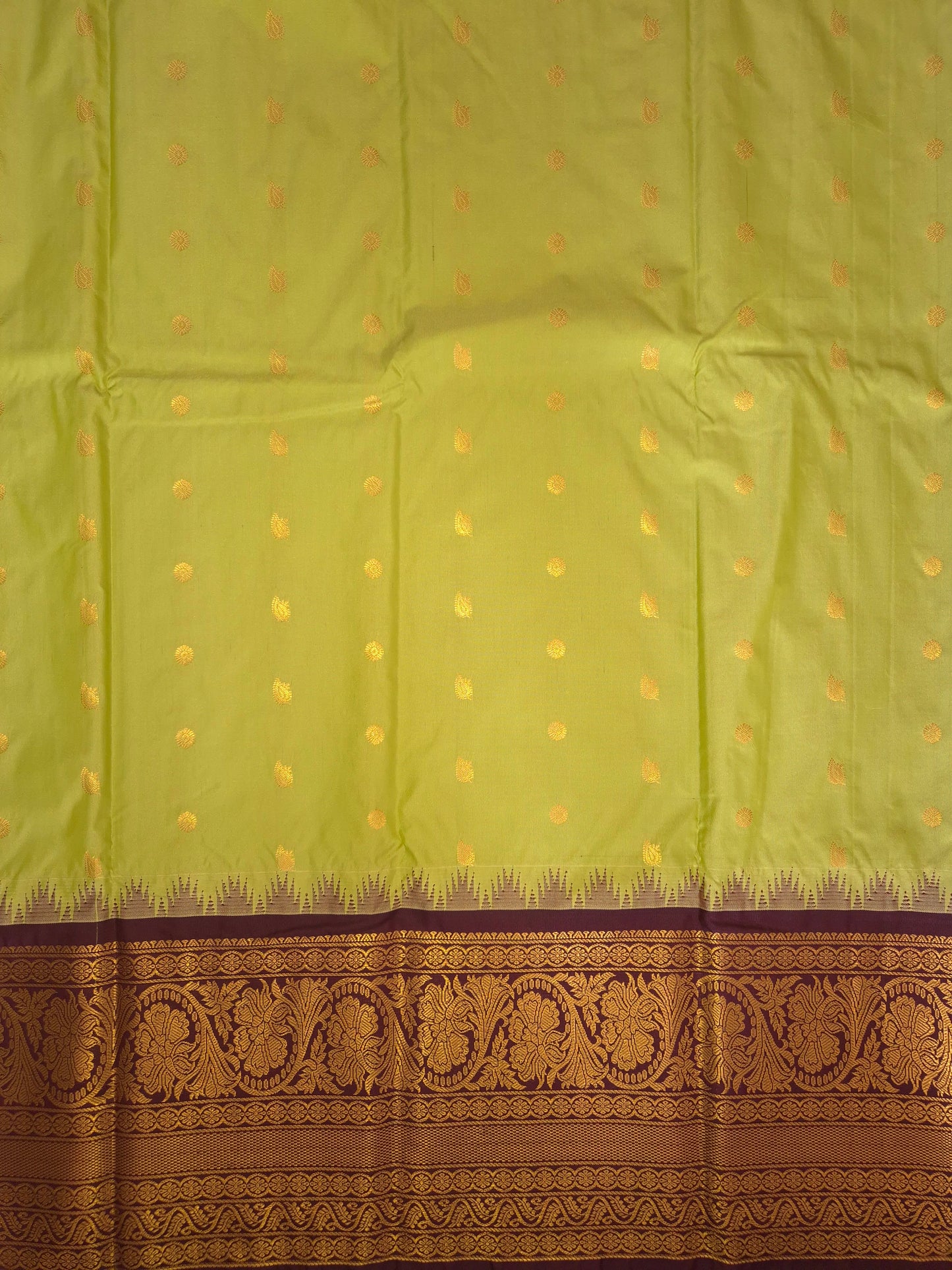 Light Green Gadwal Silk Saree with all-over Golden Buttas and Intricate Design on Wine Colour Border