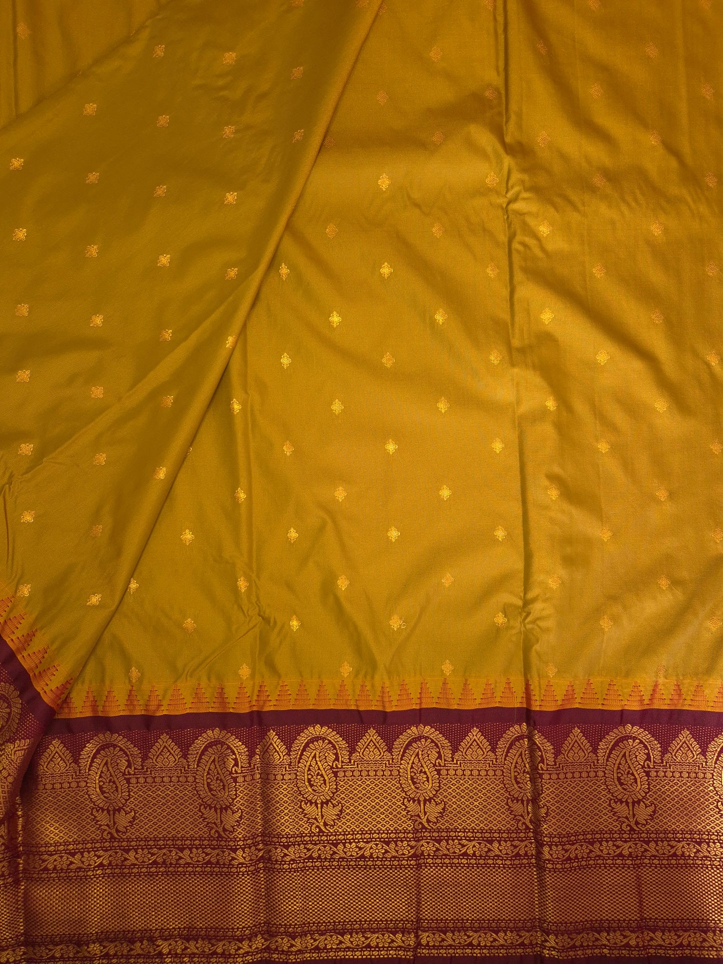 Brass Yellow Gadwal Silk Saree with all-over Golden Buttas and Intricate Design on Wine Colour Border