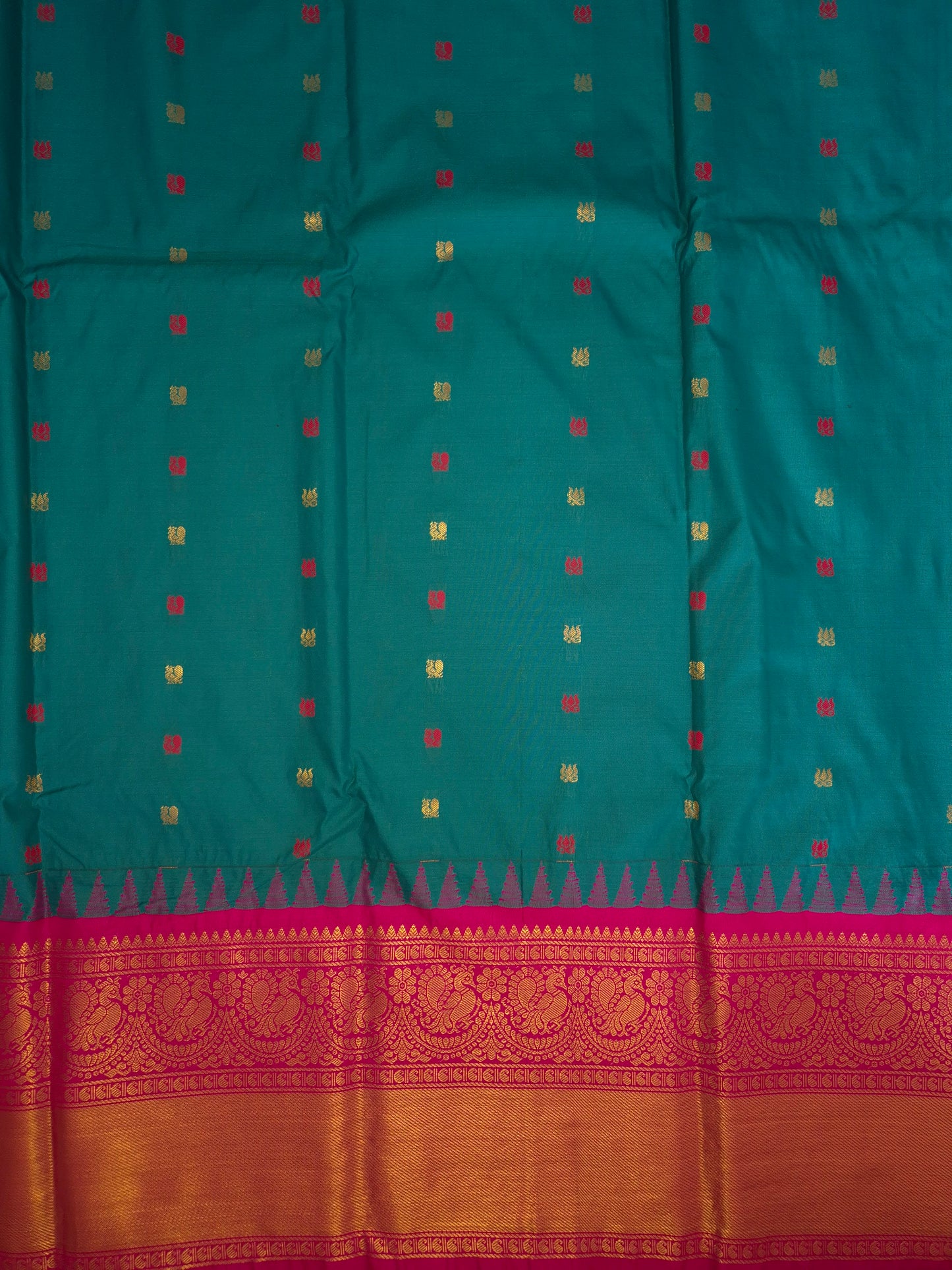 Deep Sea Green Gadwal Silk Saree with all-over Golden Buttas and Intricate Design on Rani Pink Colour Border