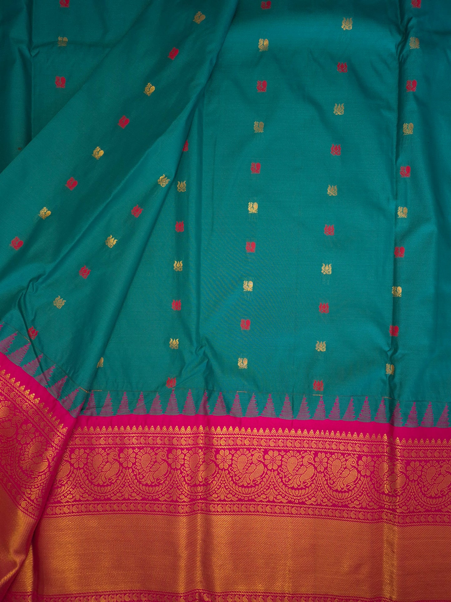 Deep Sea Green Gadwal Silk Saree with all-over Golden Buttas and Intricate Design on Rani Pink Colour Border
